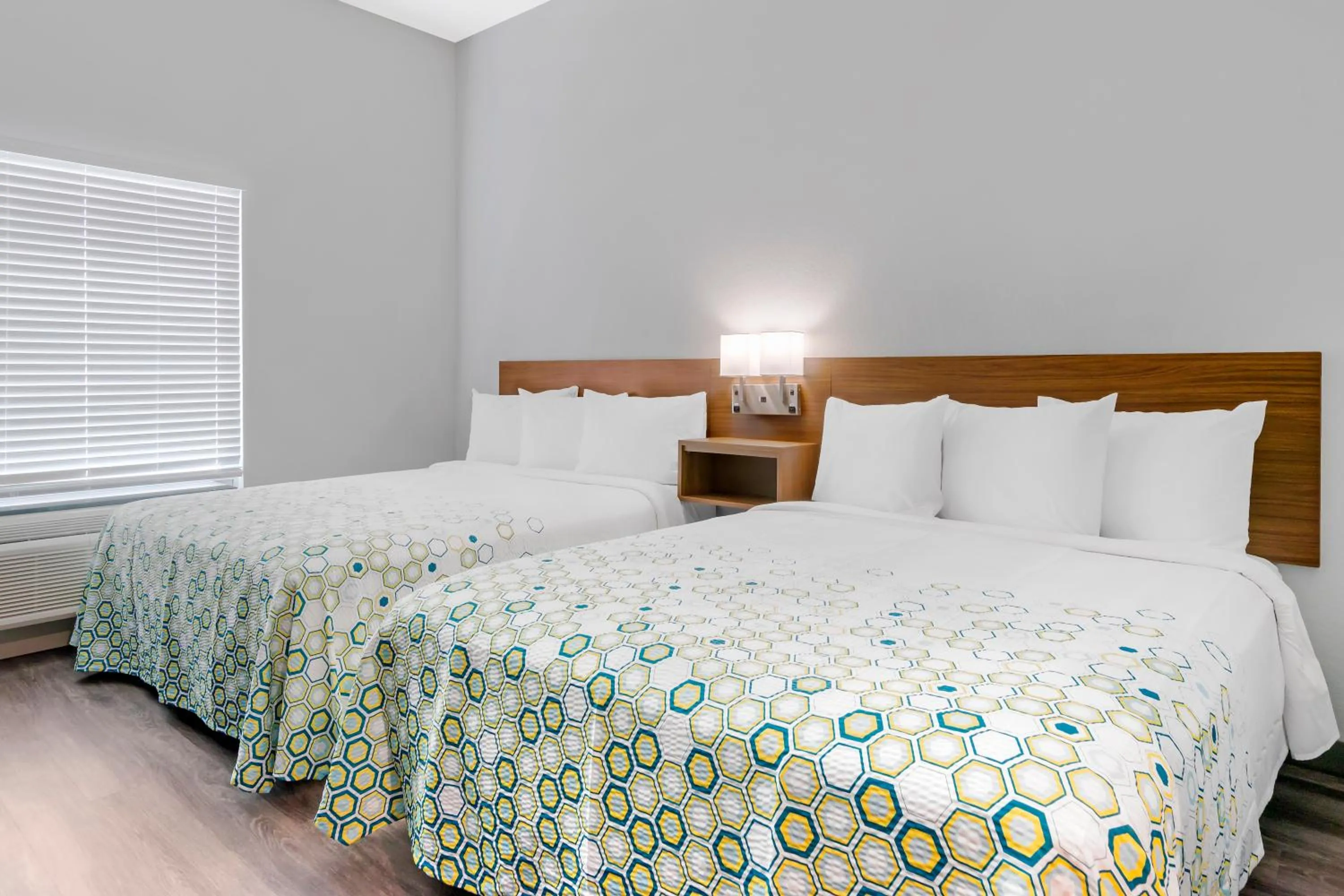 Bedroom, Bed in HomeTowne Studios by Red Roof Tampa - Airport