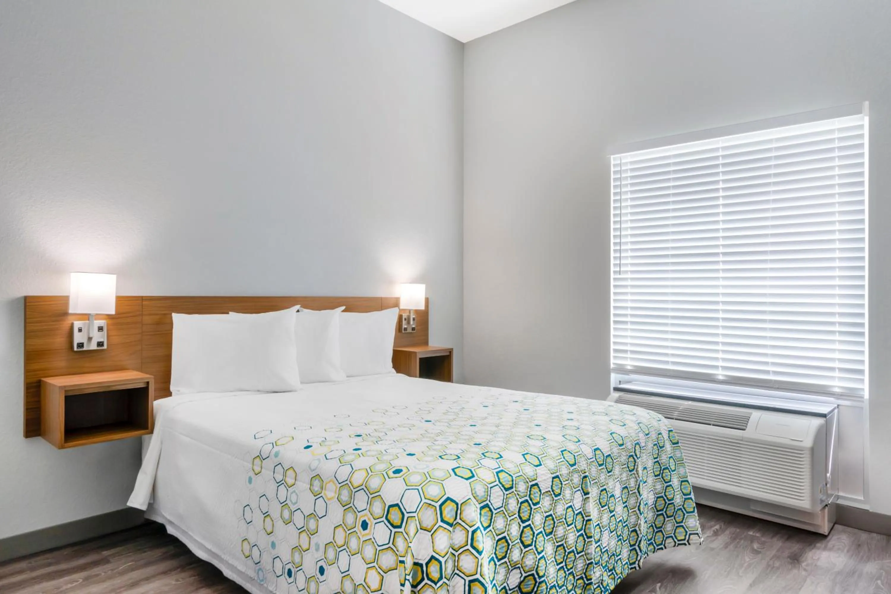 Bedroom, Bed in HomeTowne Studios by Red Roof Tampa - Airport