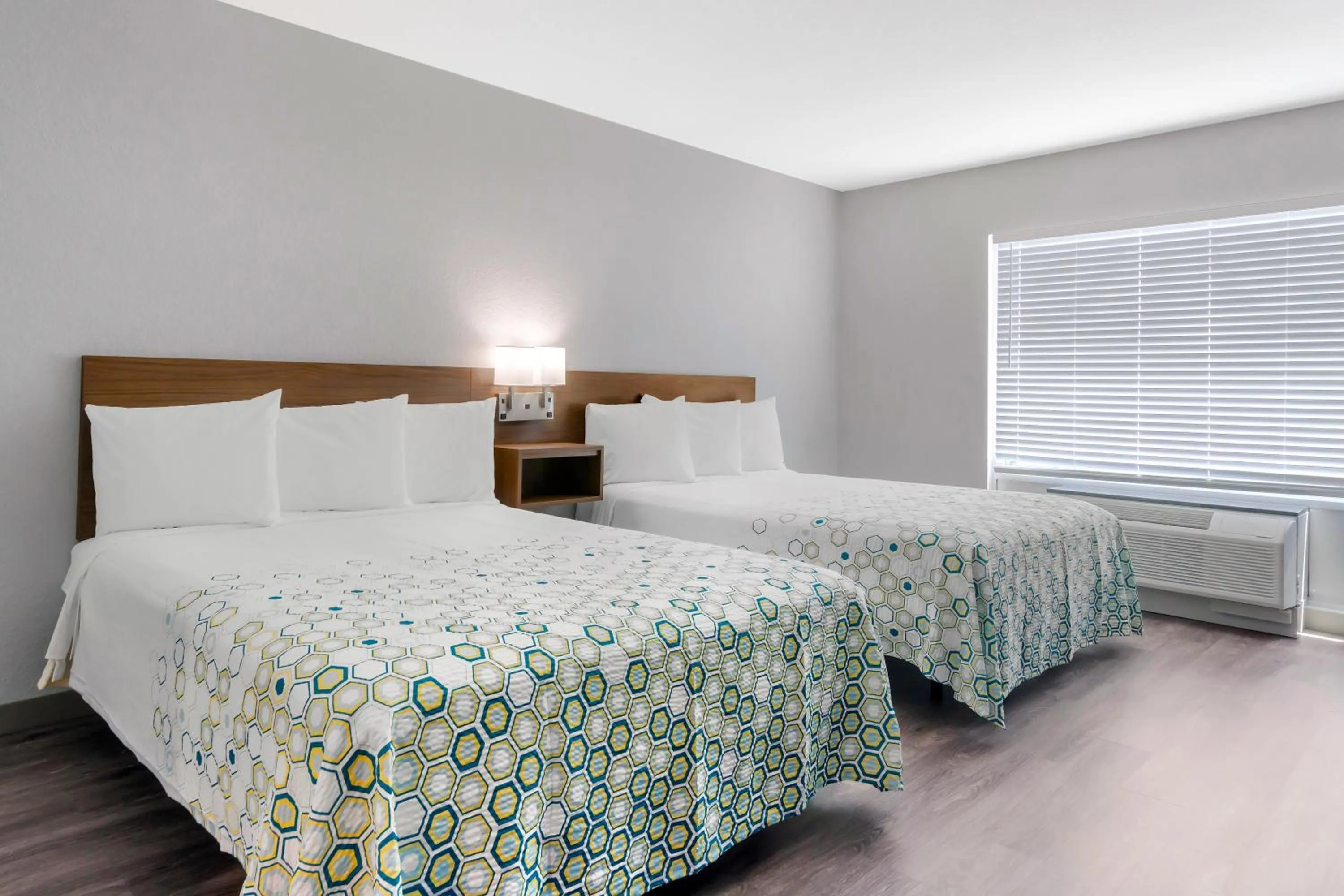 Bedroom, Bed in HomeTowne Studios by Red Roof Tampa - Airport