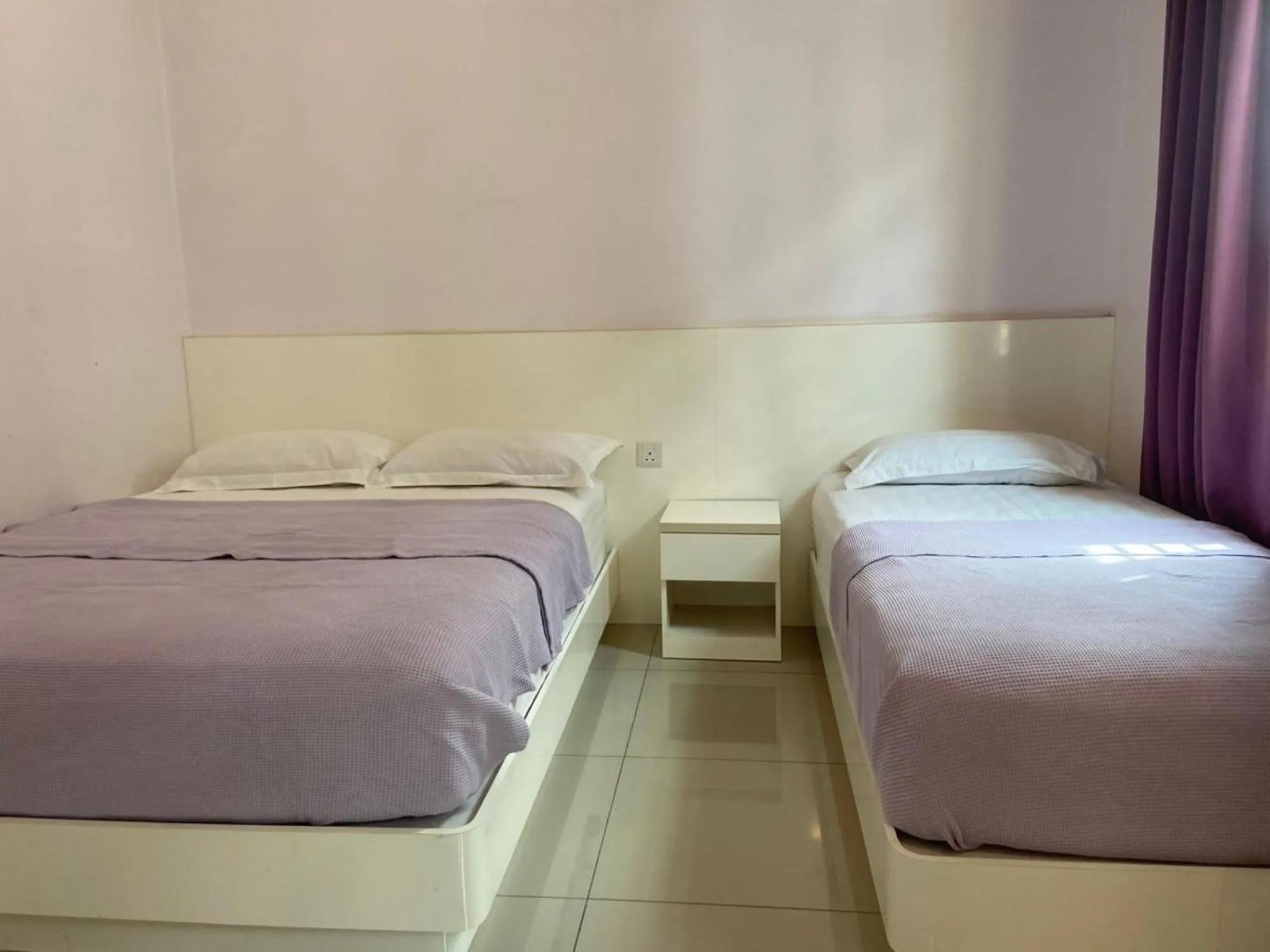 Bed in Lavender Riverside Hotel