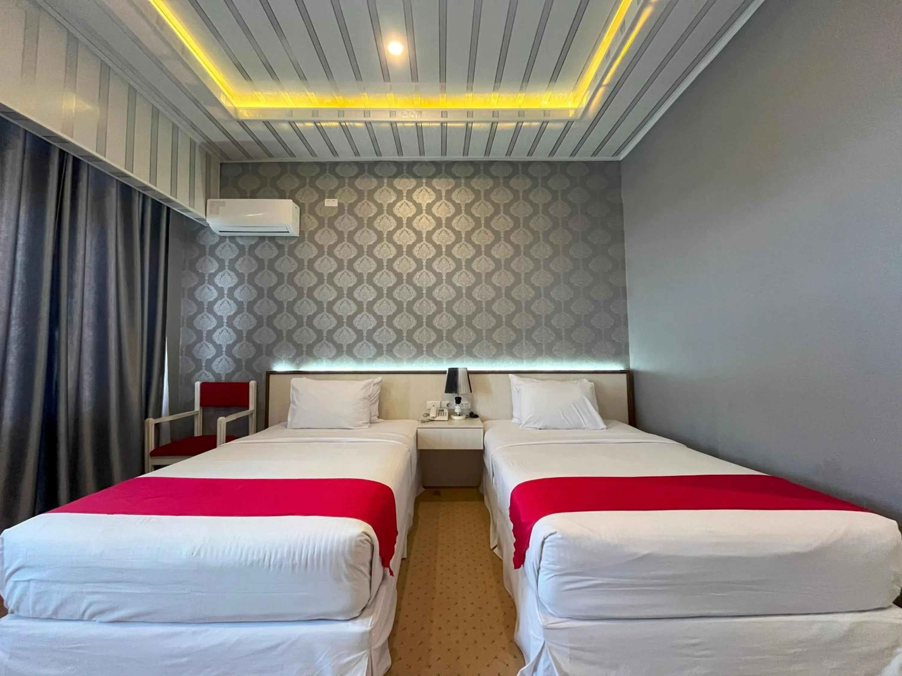 Bed in Grand Tamaro Hotel