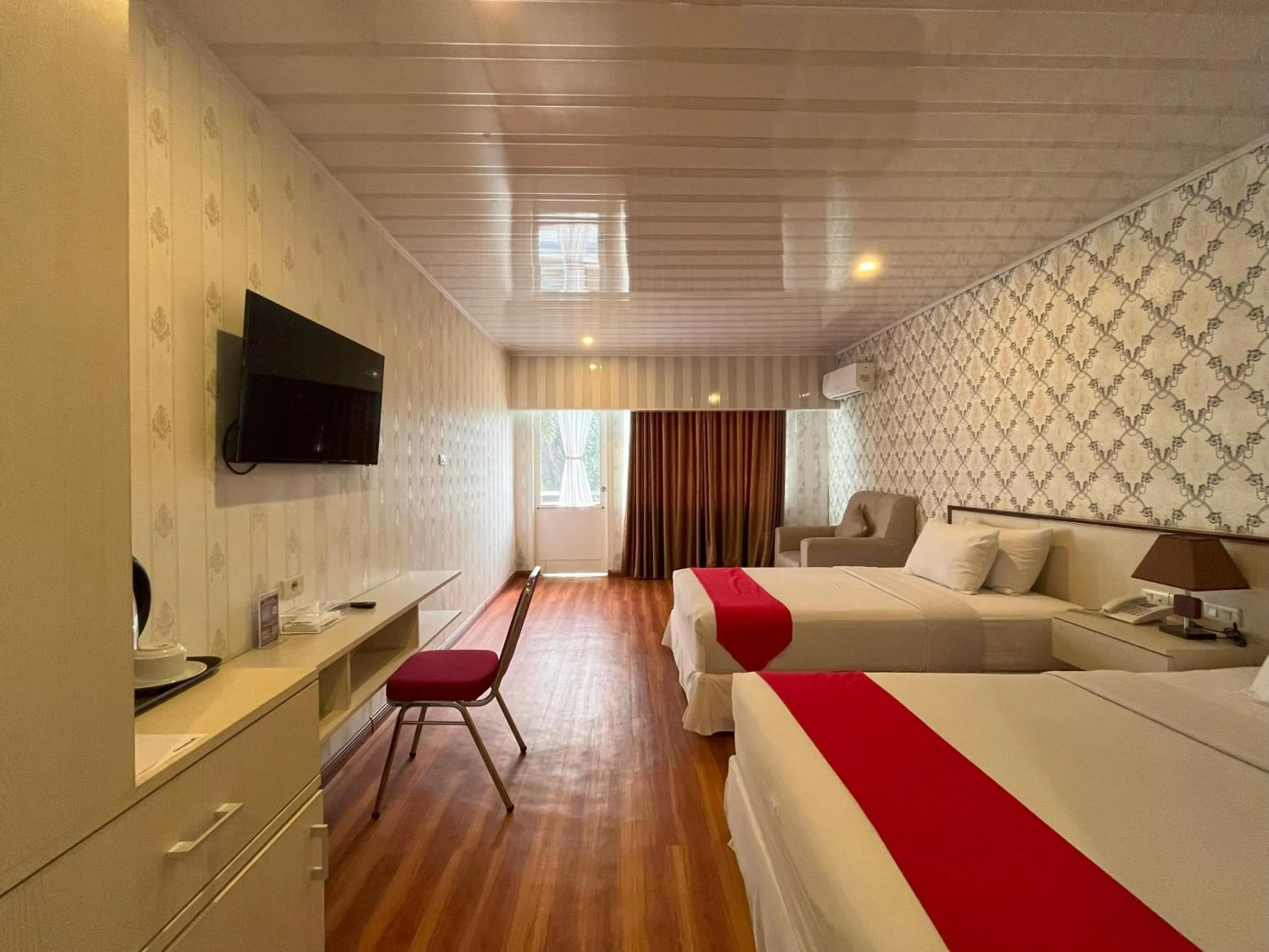 Bed in Grand Tamaro Hotel