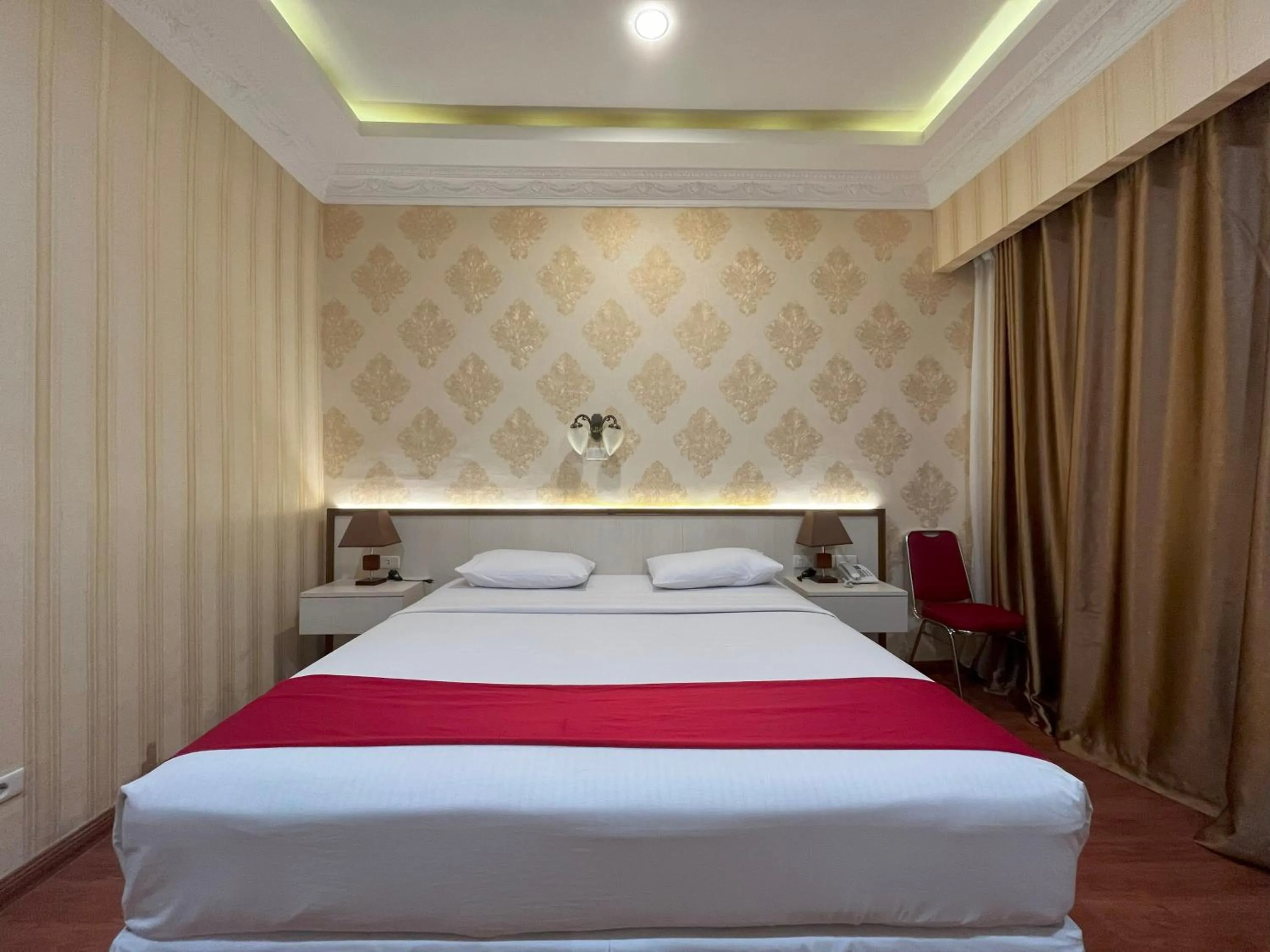 Bed in Grand Tamaro Hotel