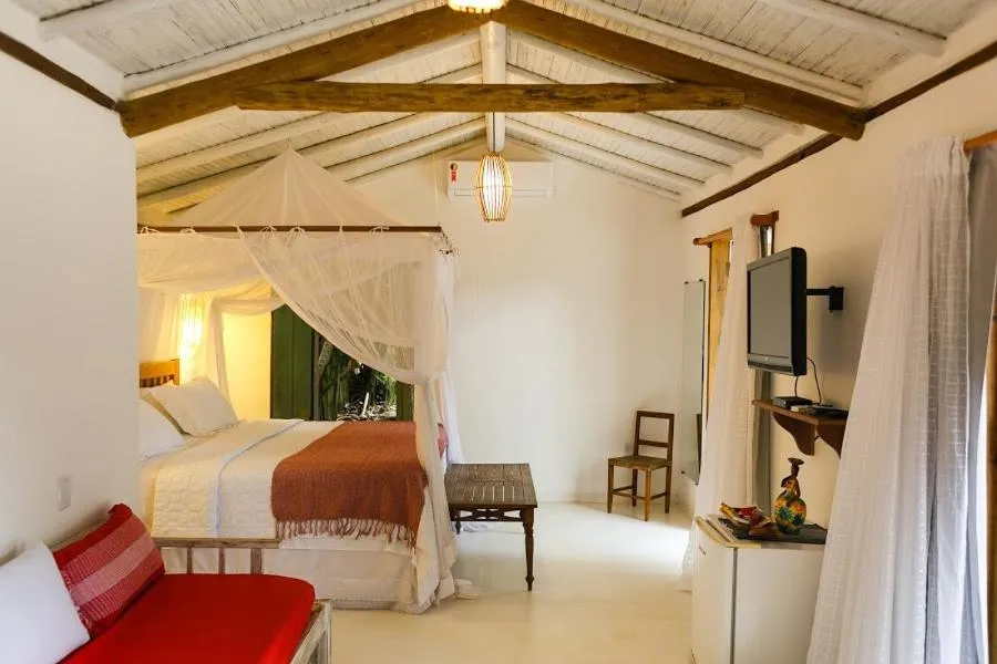 Bed in Pousada Hibisco