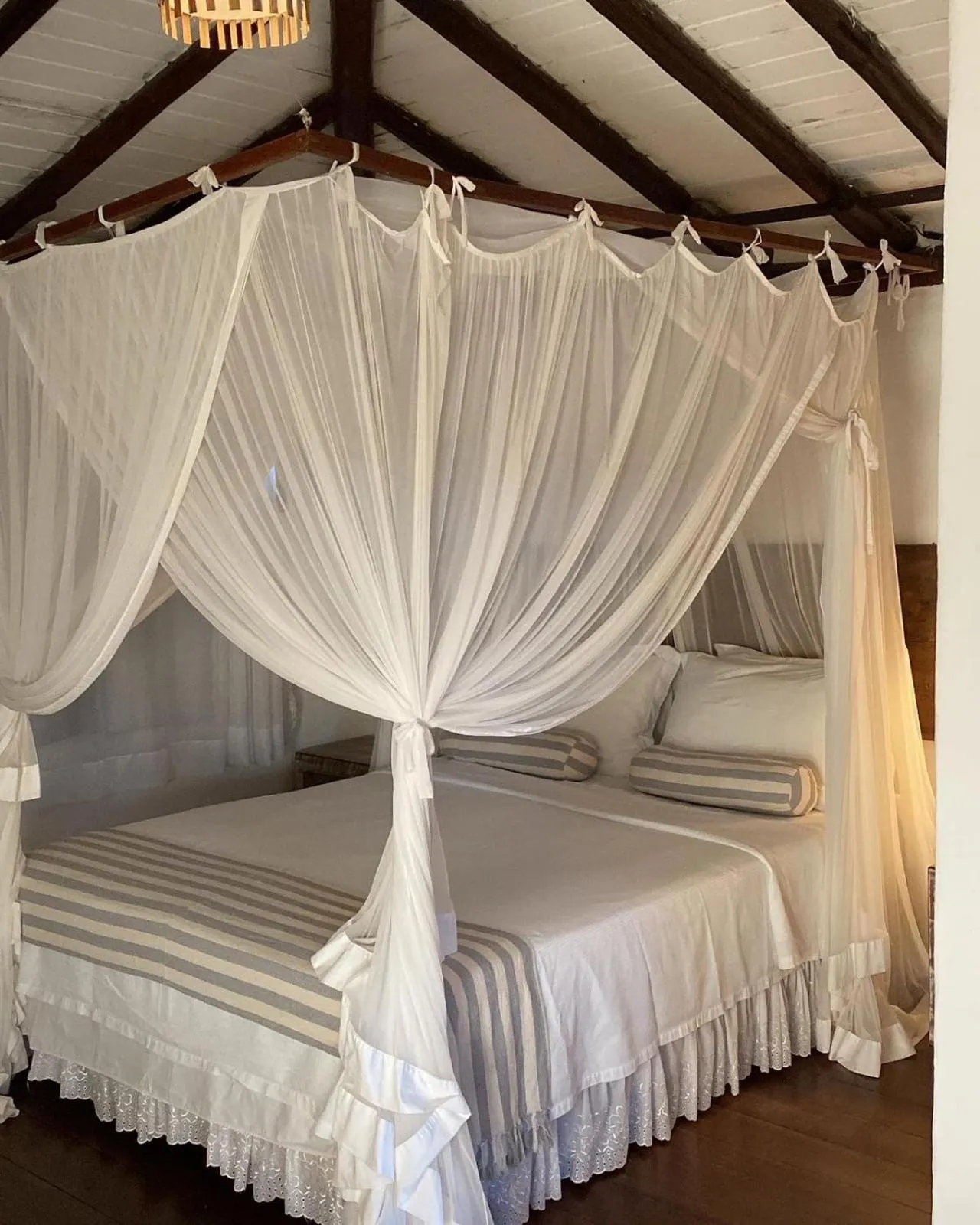 Bed in Pousada Hibisco