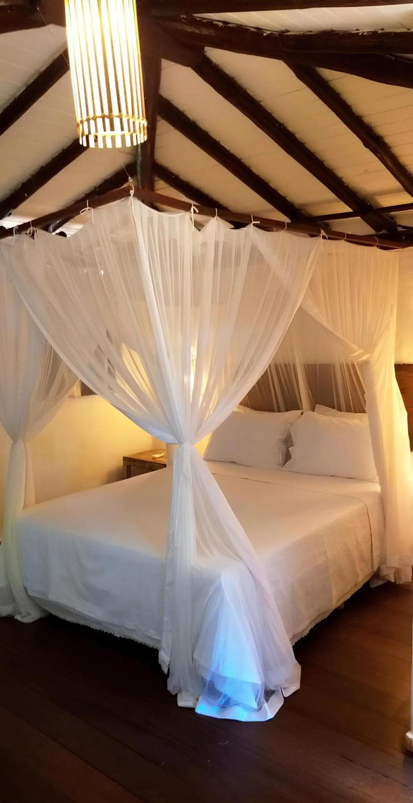 Bed in Pousada Hibisco