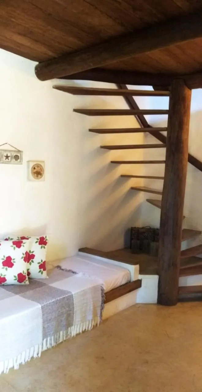 Bed in Pousada Hibisco