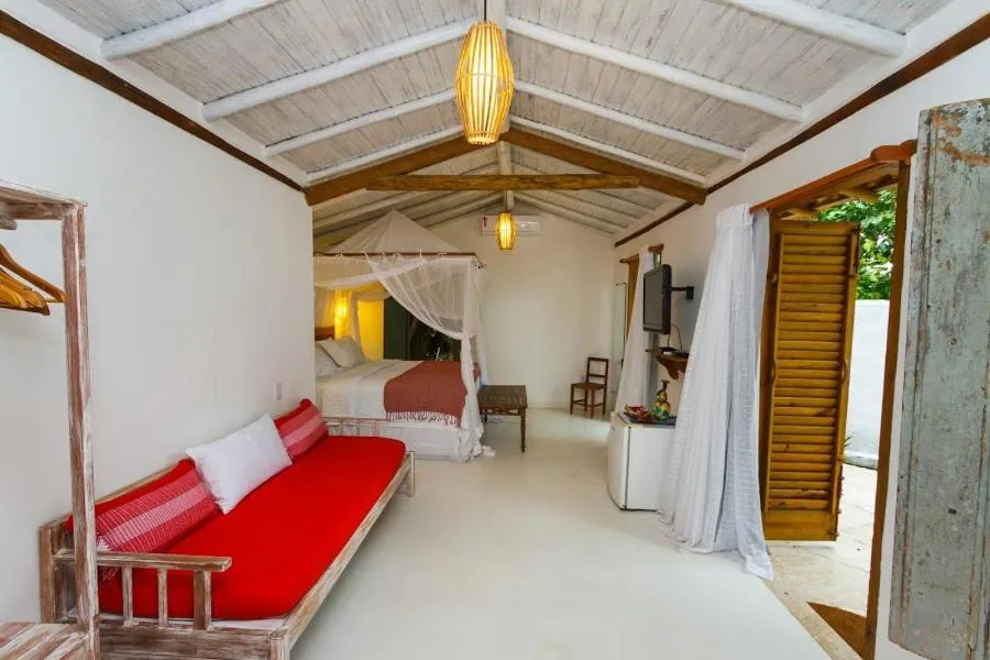 Bed in Pousada Hibisco