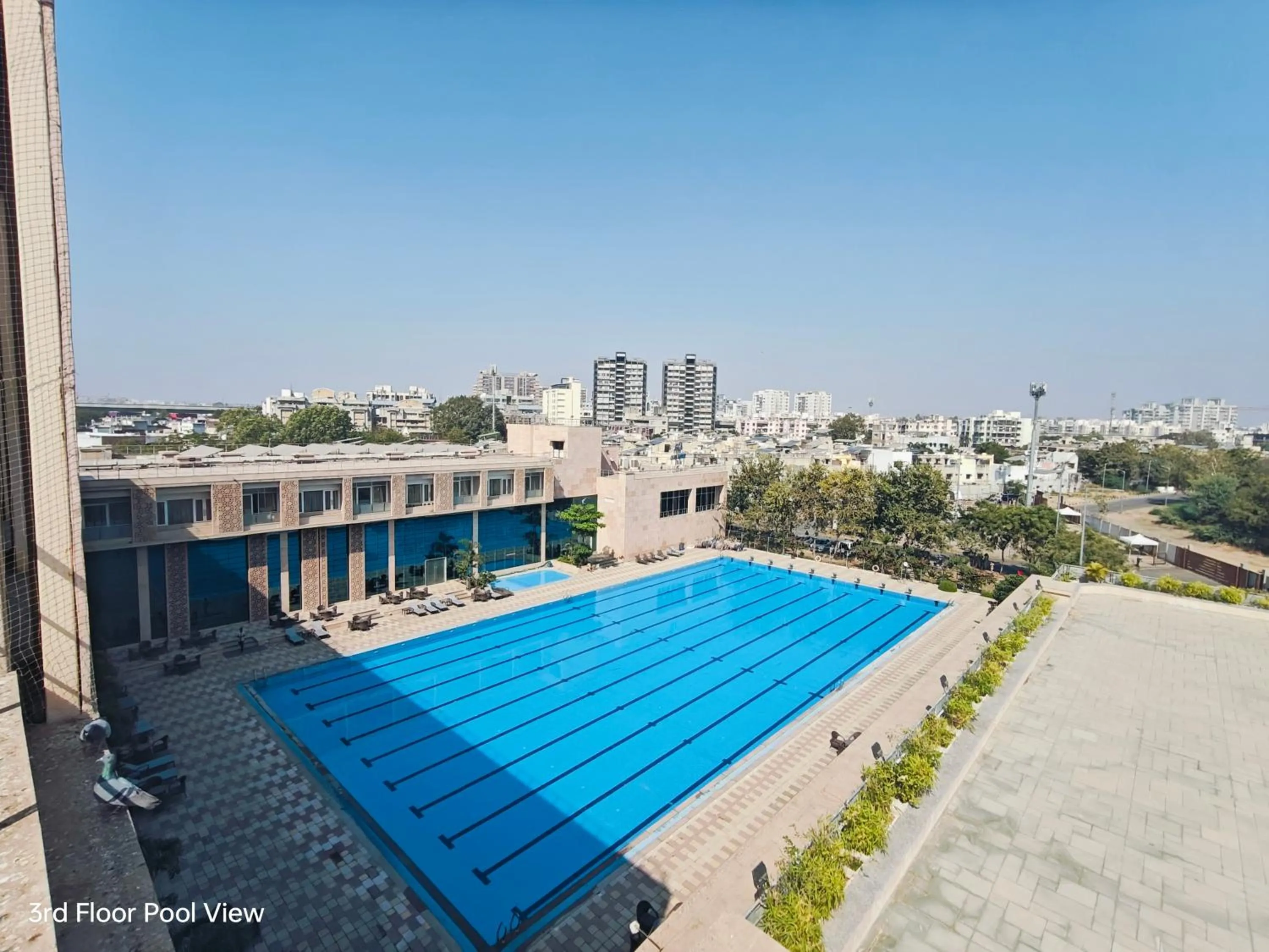 Swimming pool in Ramada by Wyndham Ahmedabad Narendra Modi Stadium Motera