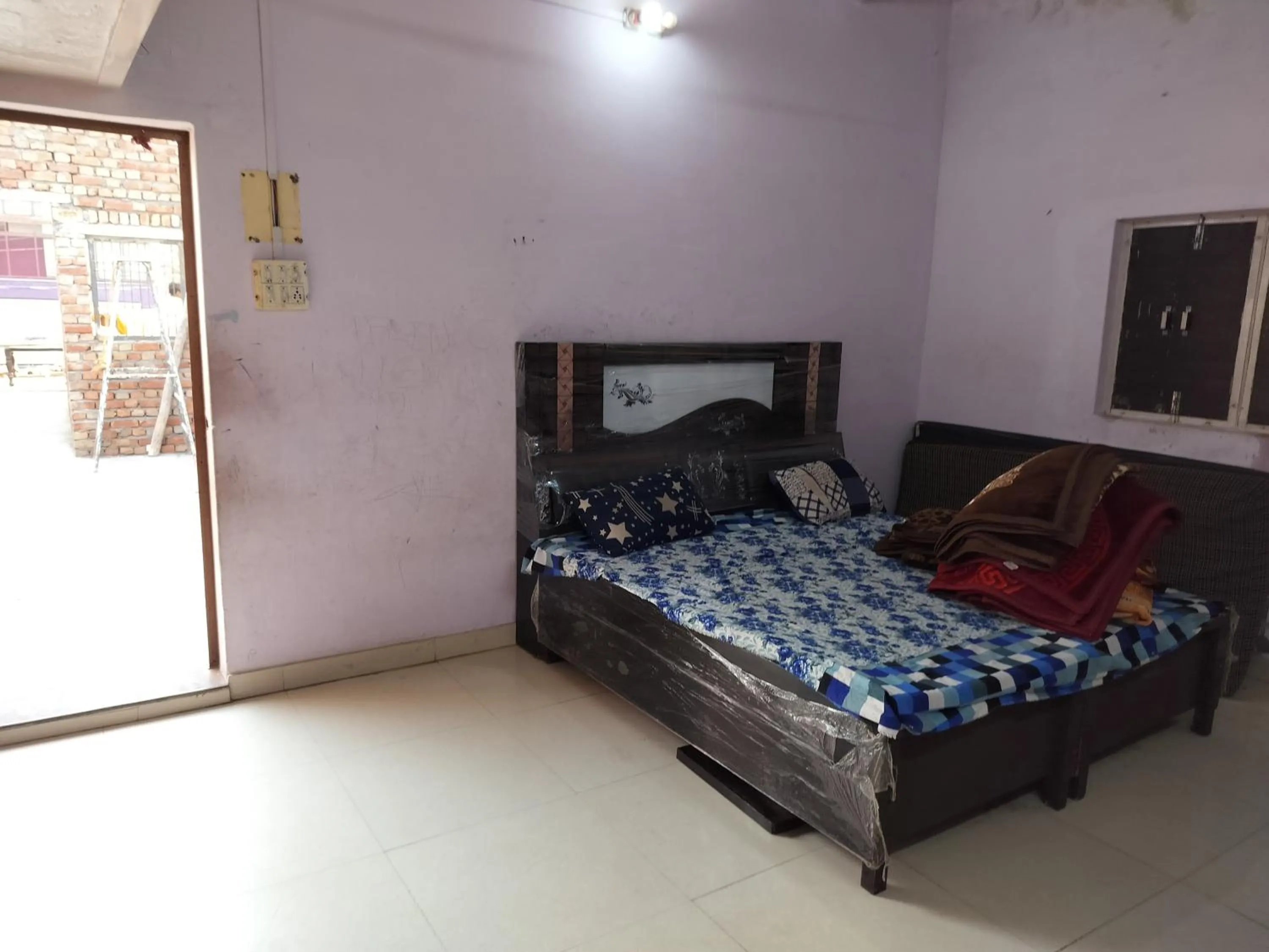Bed in Shri Krishna Kunj homestay