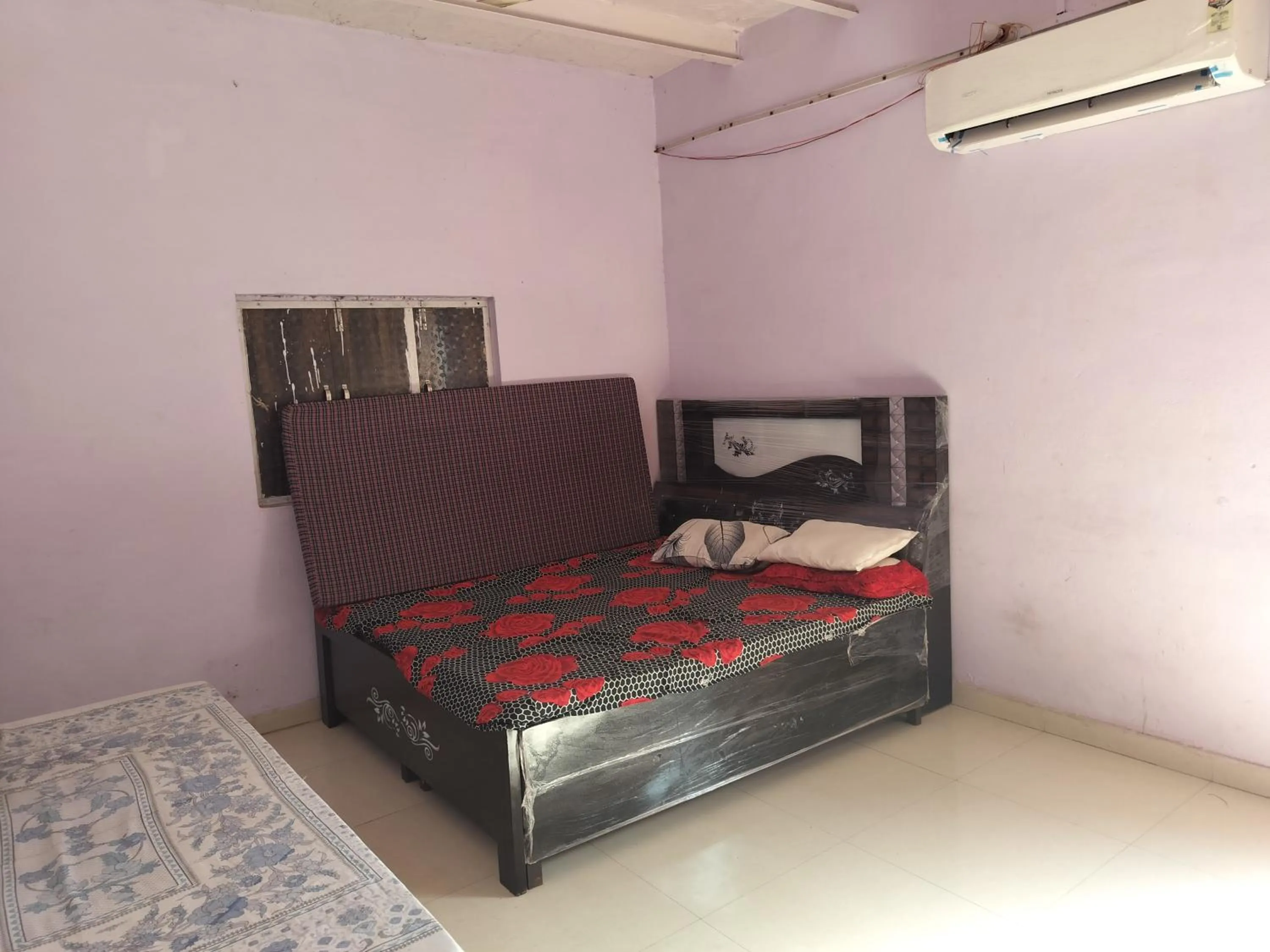 Bed in Shri Krishna Kunj homestay