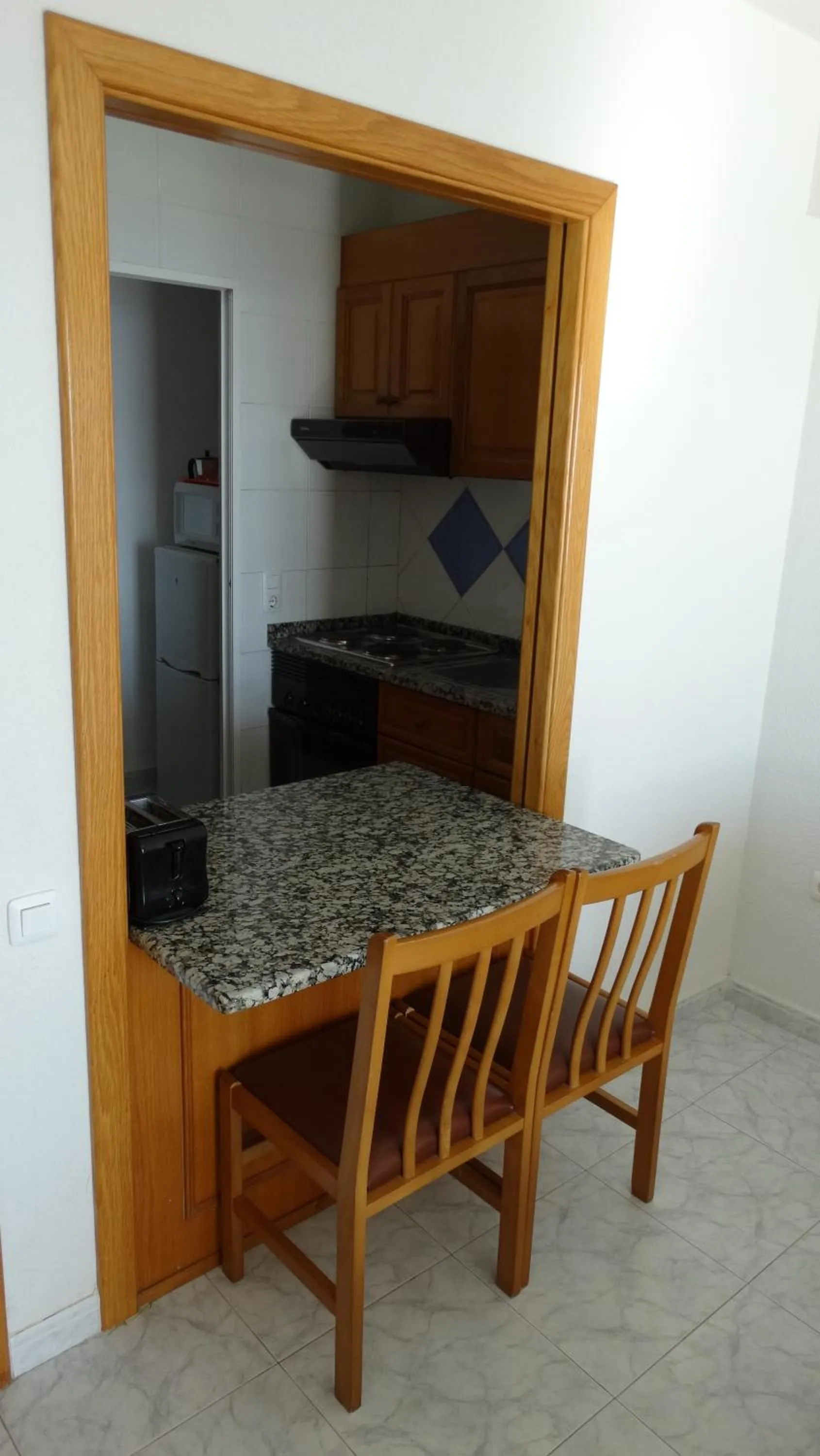 Kitchen or kitchenette in Apartamentos Beni-Beach
