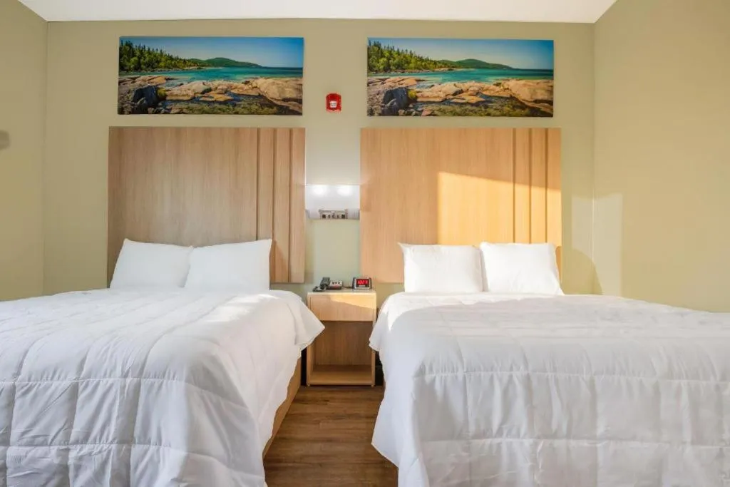 Bed in Royal Inn & Suites