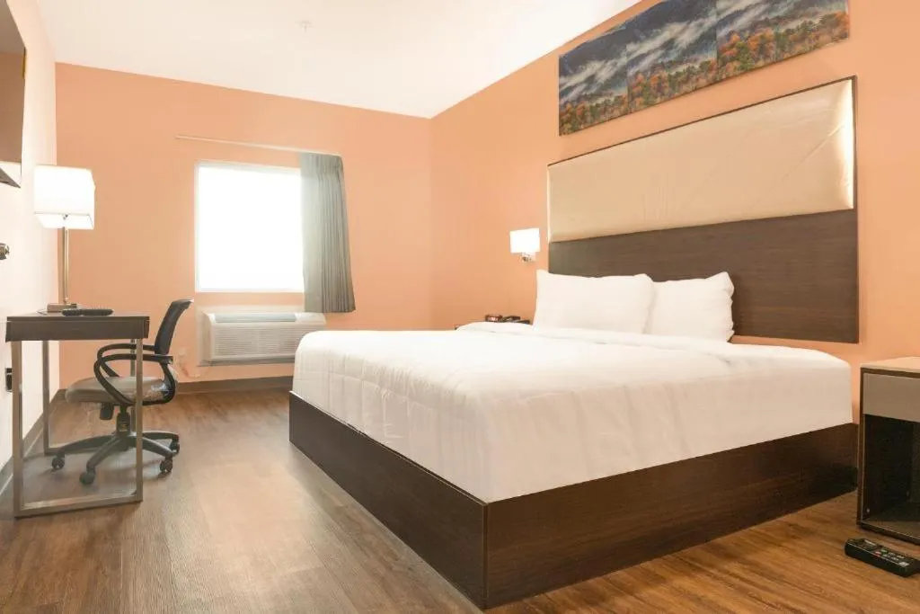 Bed in Royal Inn & Suites