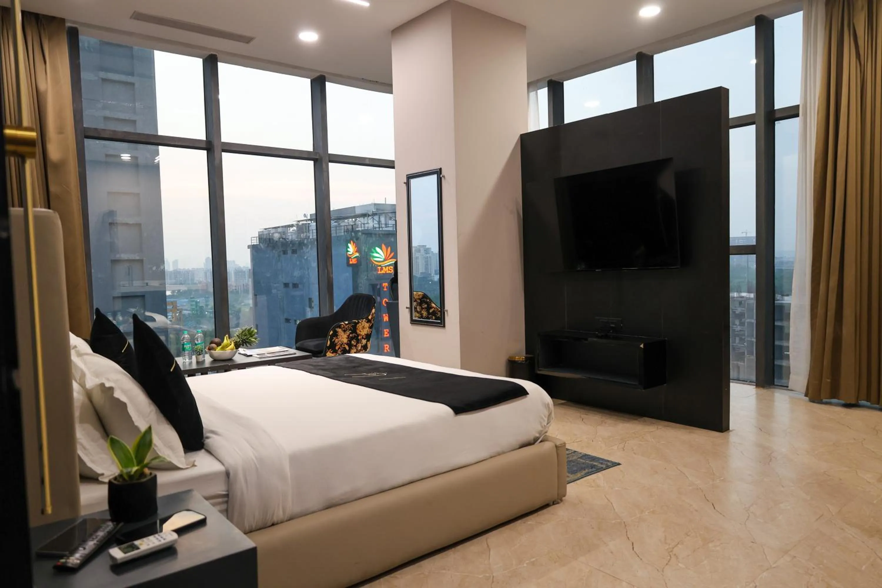 Photo of the whole room, Bed in Aquila Grand Suites - Noida Sector 136