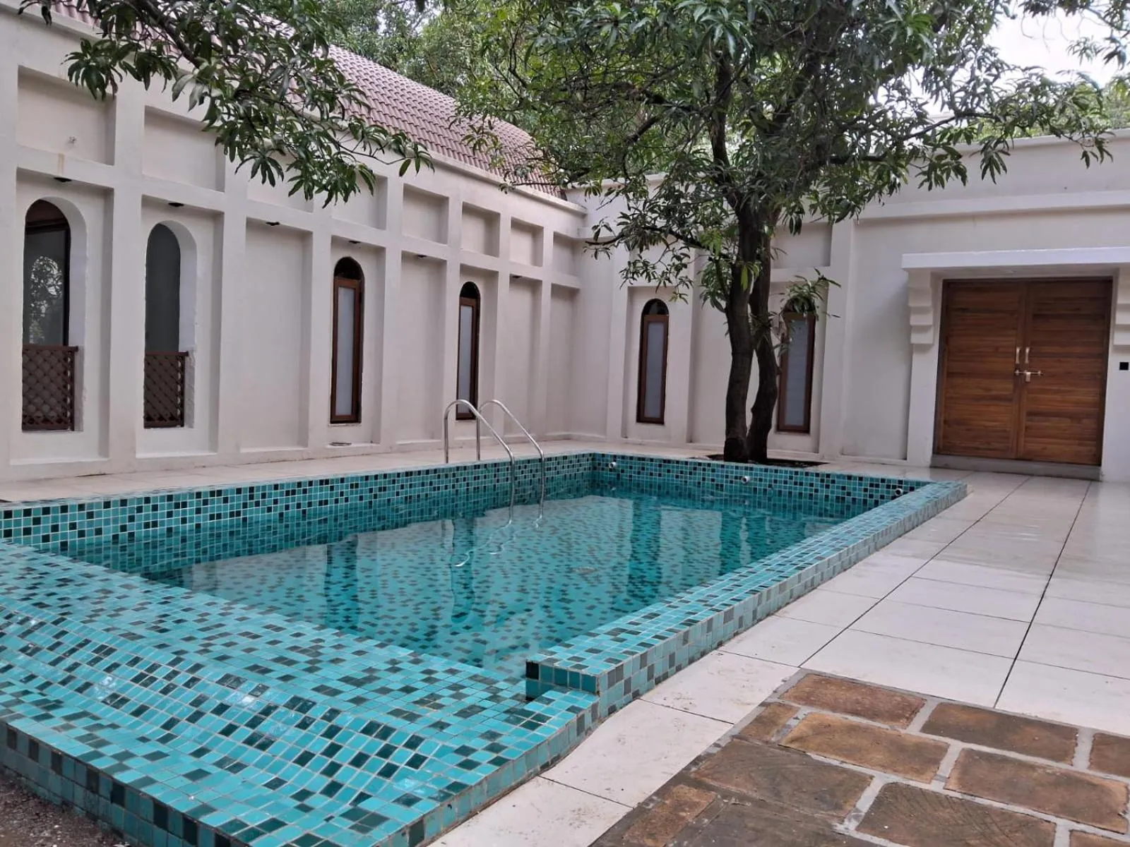 Swimming pool in Le Casa Lion Resort A Premium Resort In Sasan Gir