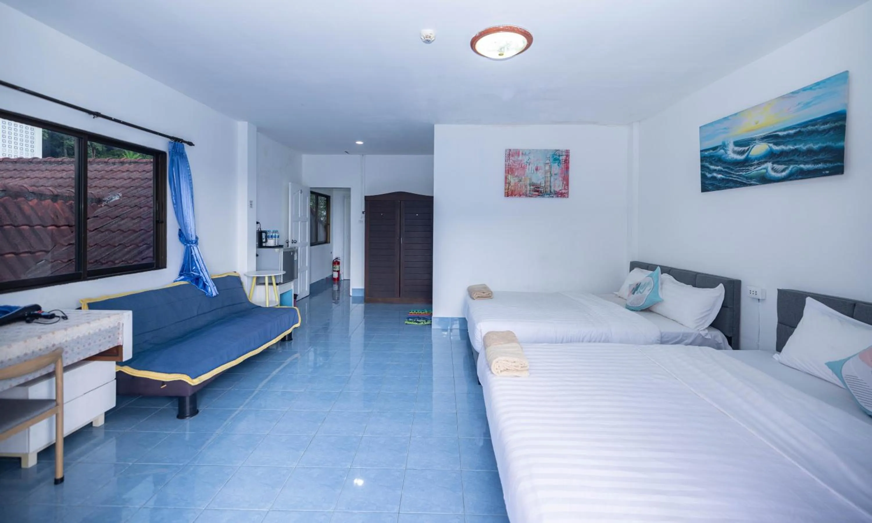 Bed in Belle Cose Guest House Phuket