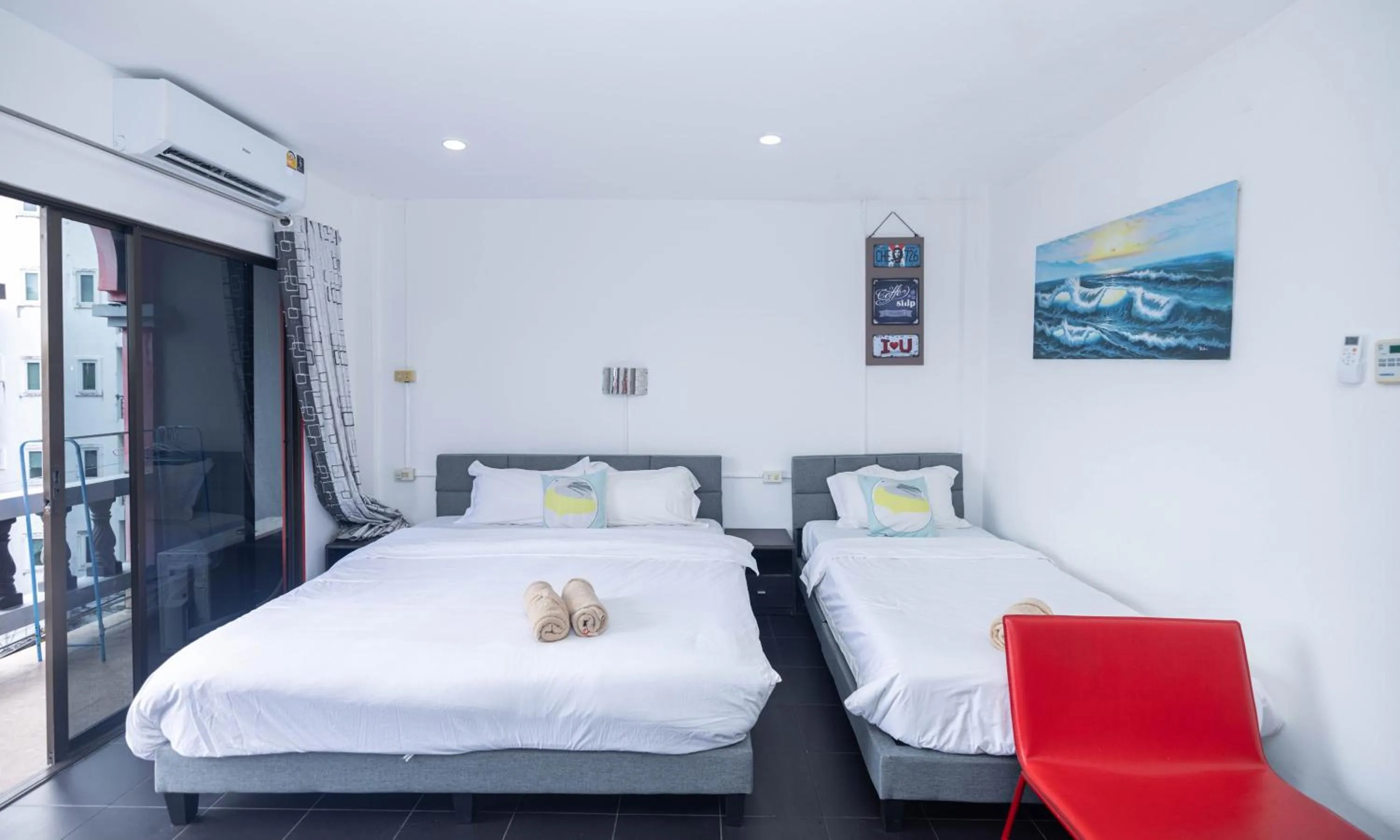 Bed in Belle Cose Guest House Phuket