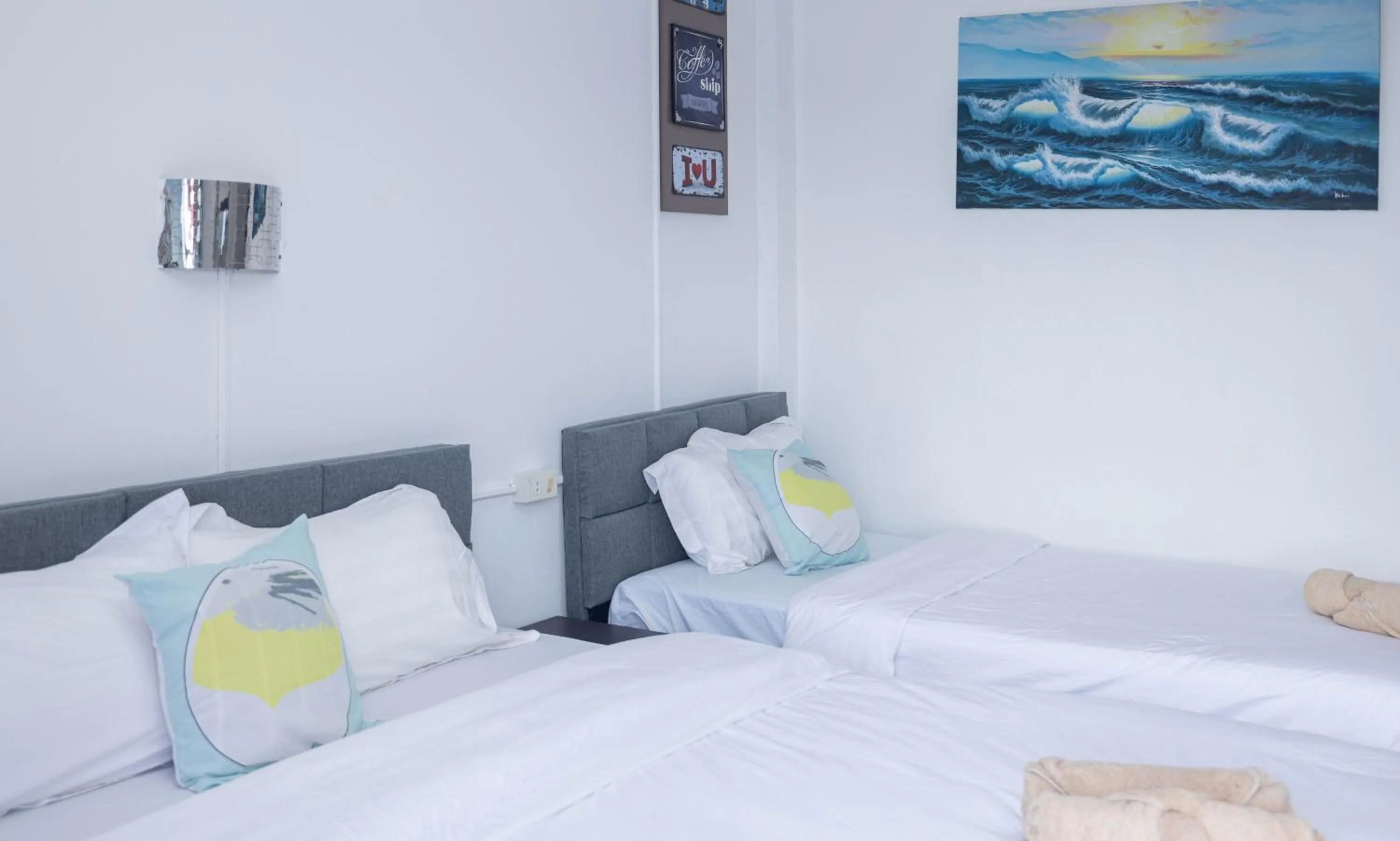 Bed in Belle Cose Guest House Phuket