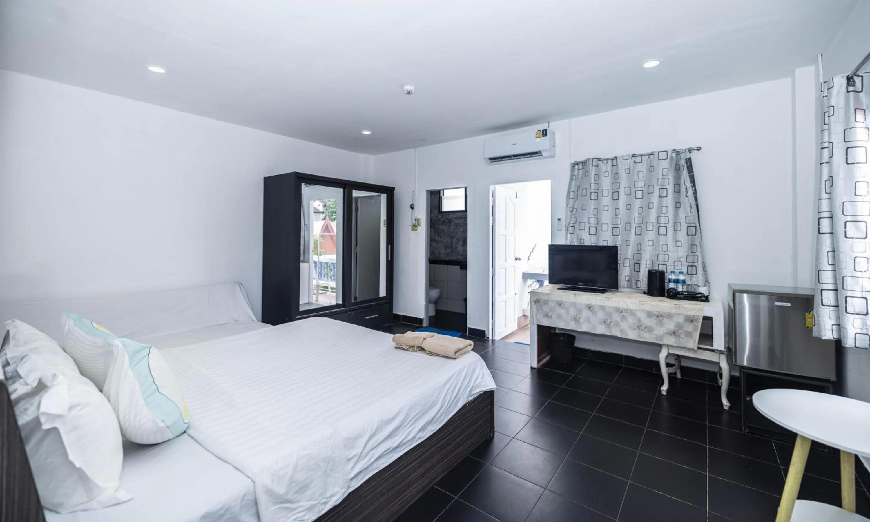 Bed in Belle Cose Guest House Phuket