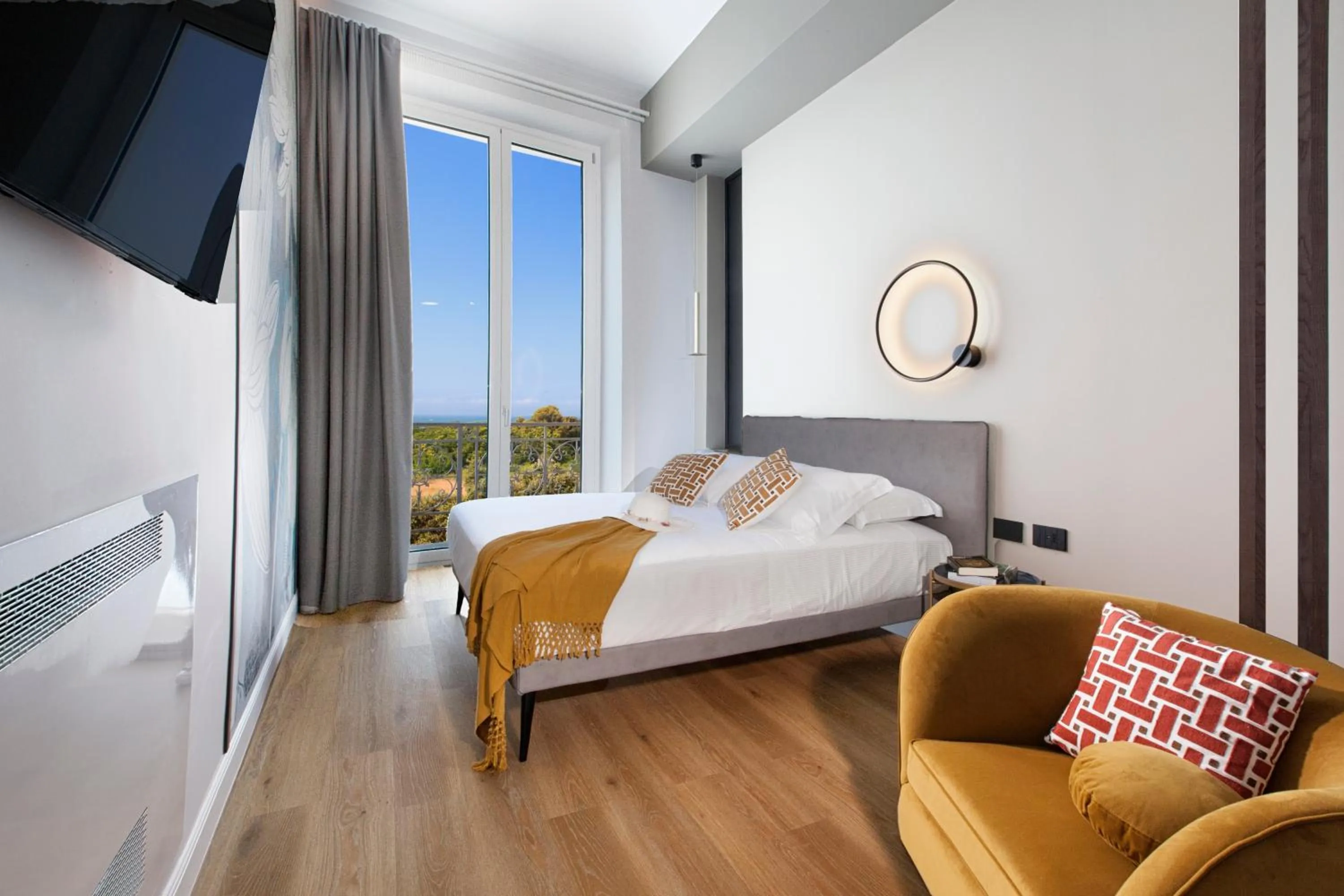 Bed in Vesuvius Palace Aparthotel