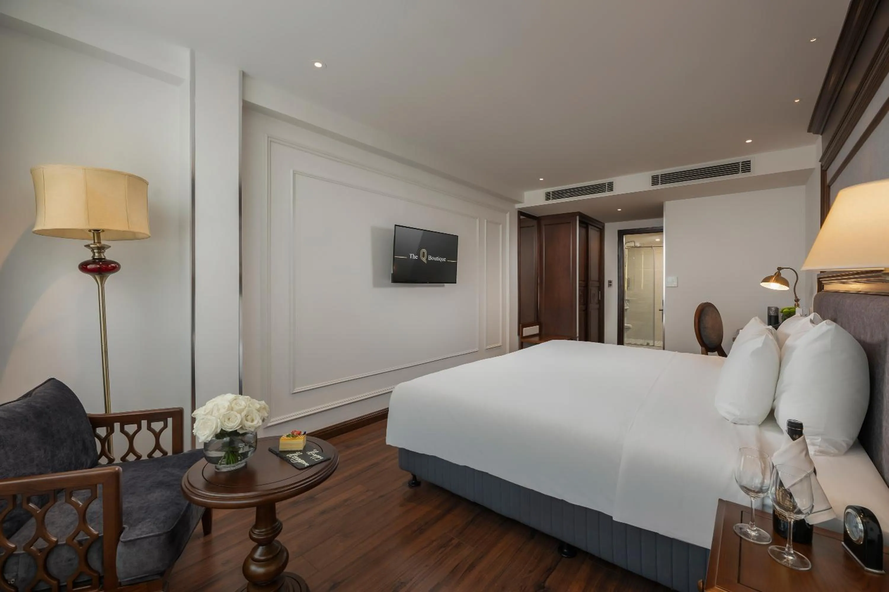 Bed in The Q Boutique Hotel