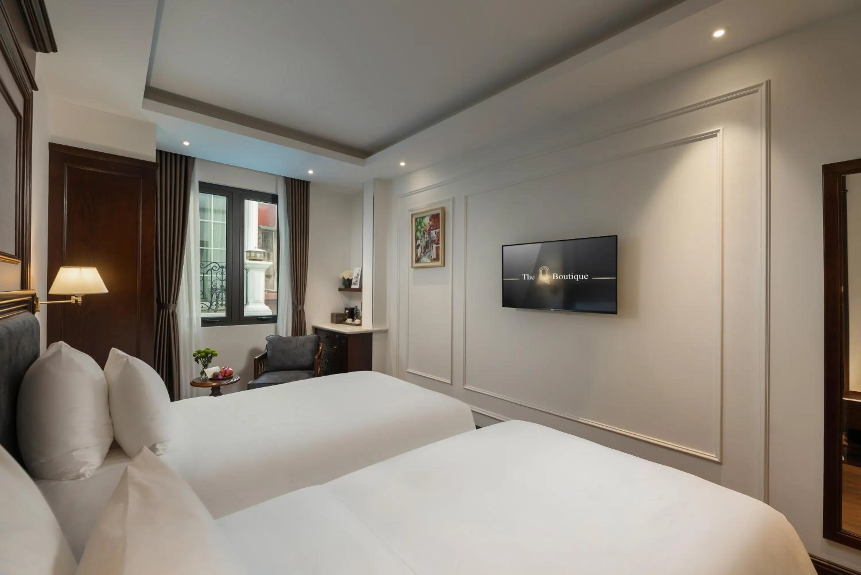 Bed in The Q Boutique Hotel