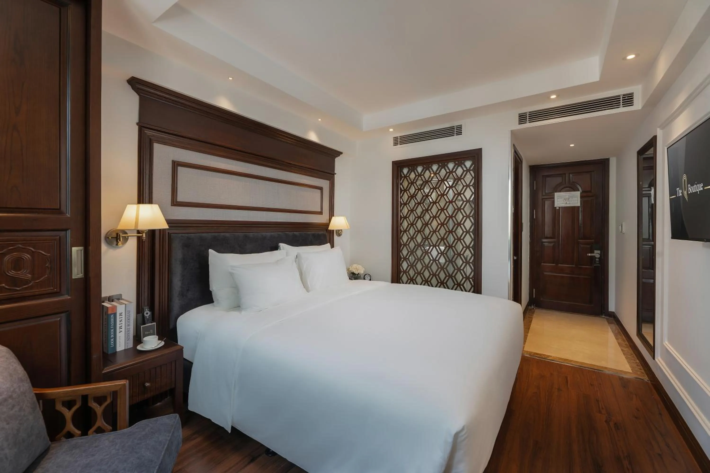 Bed in The Q Boutique Hotel