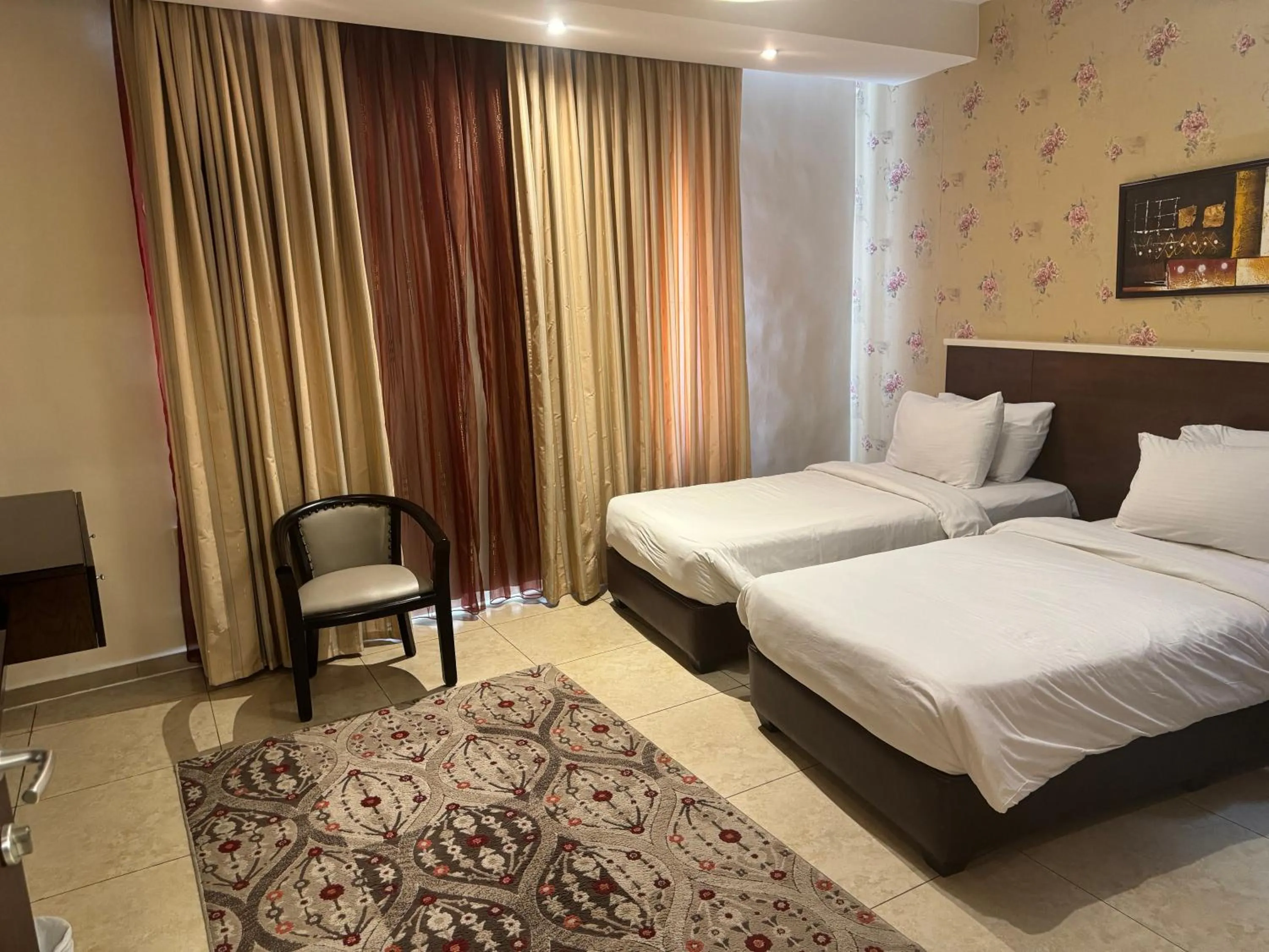 Bed in City Rose Hotel Suites