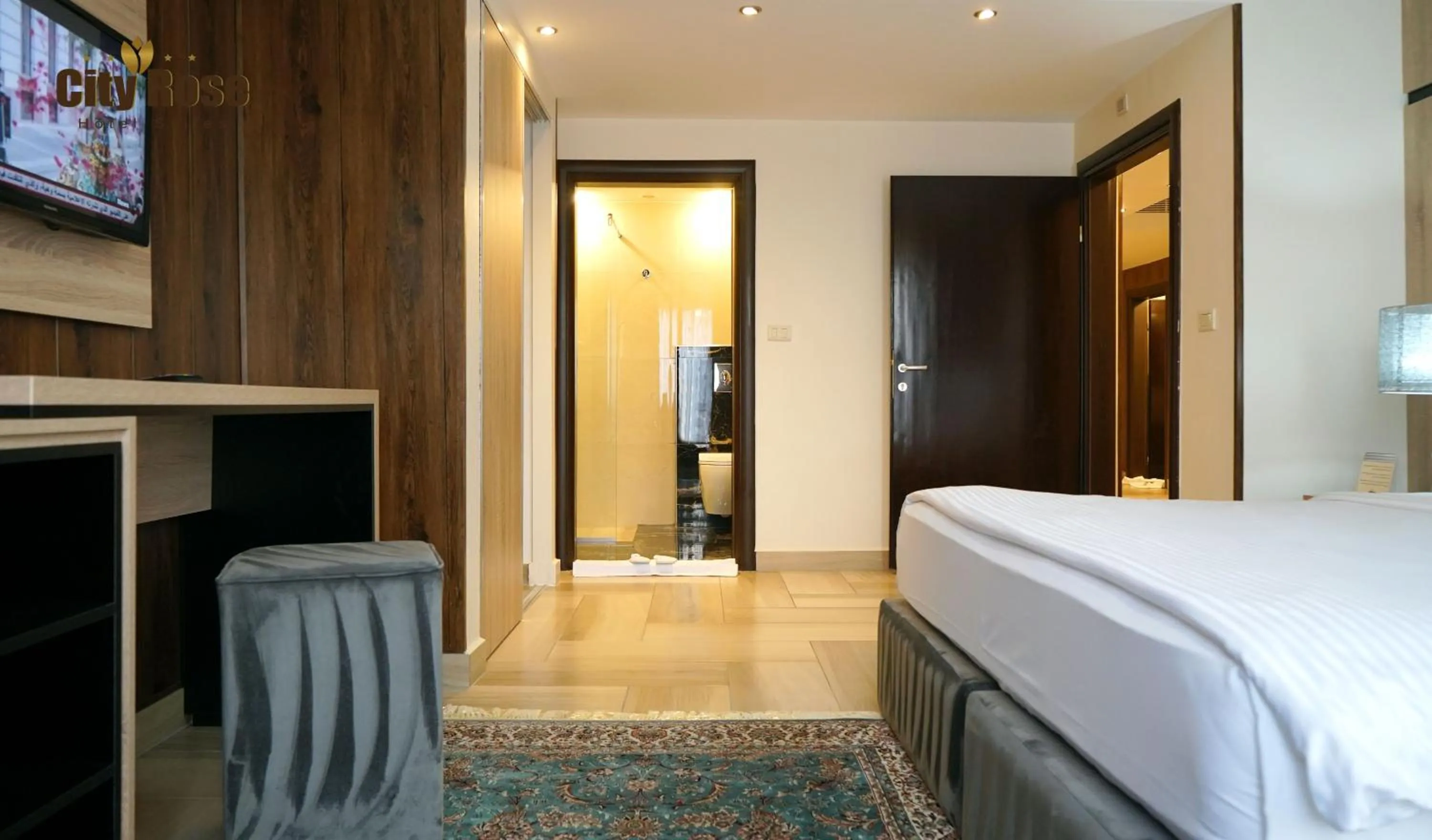 Bed in City Rose Hotel Suites