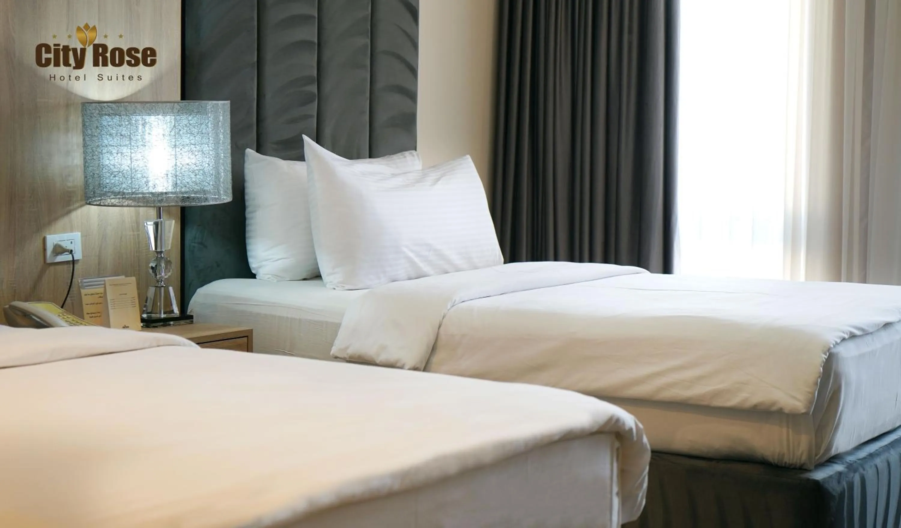 Bed in City Rose Hotel Suites