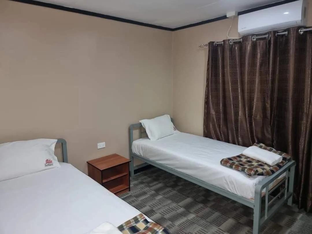 Bed in Al - Minhaj Service Apartments