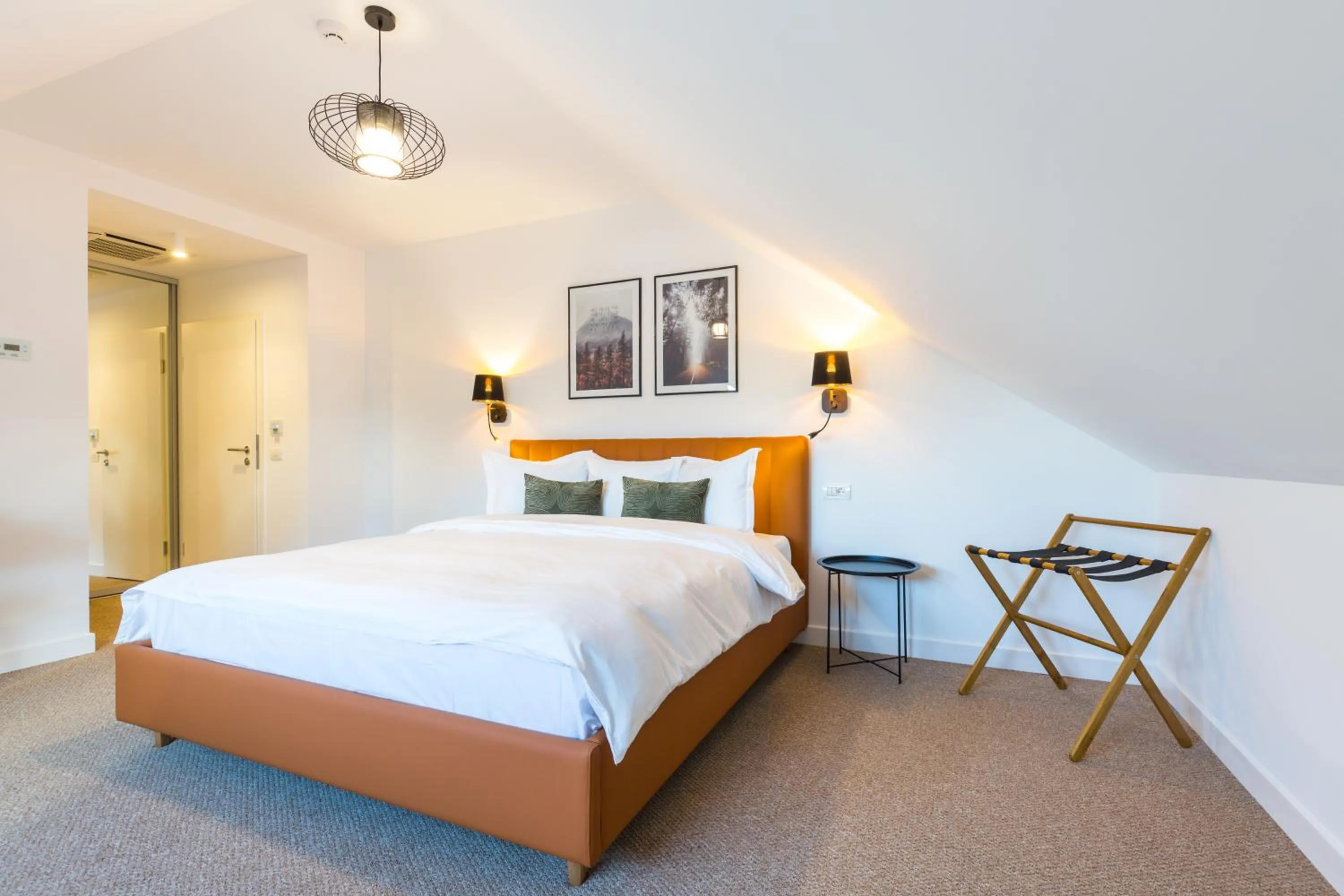 Bed in UpperHouse Suites & More