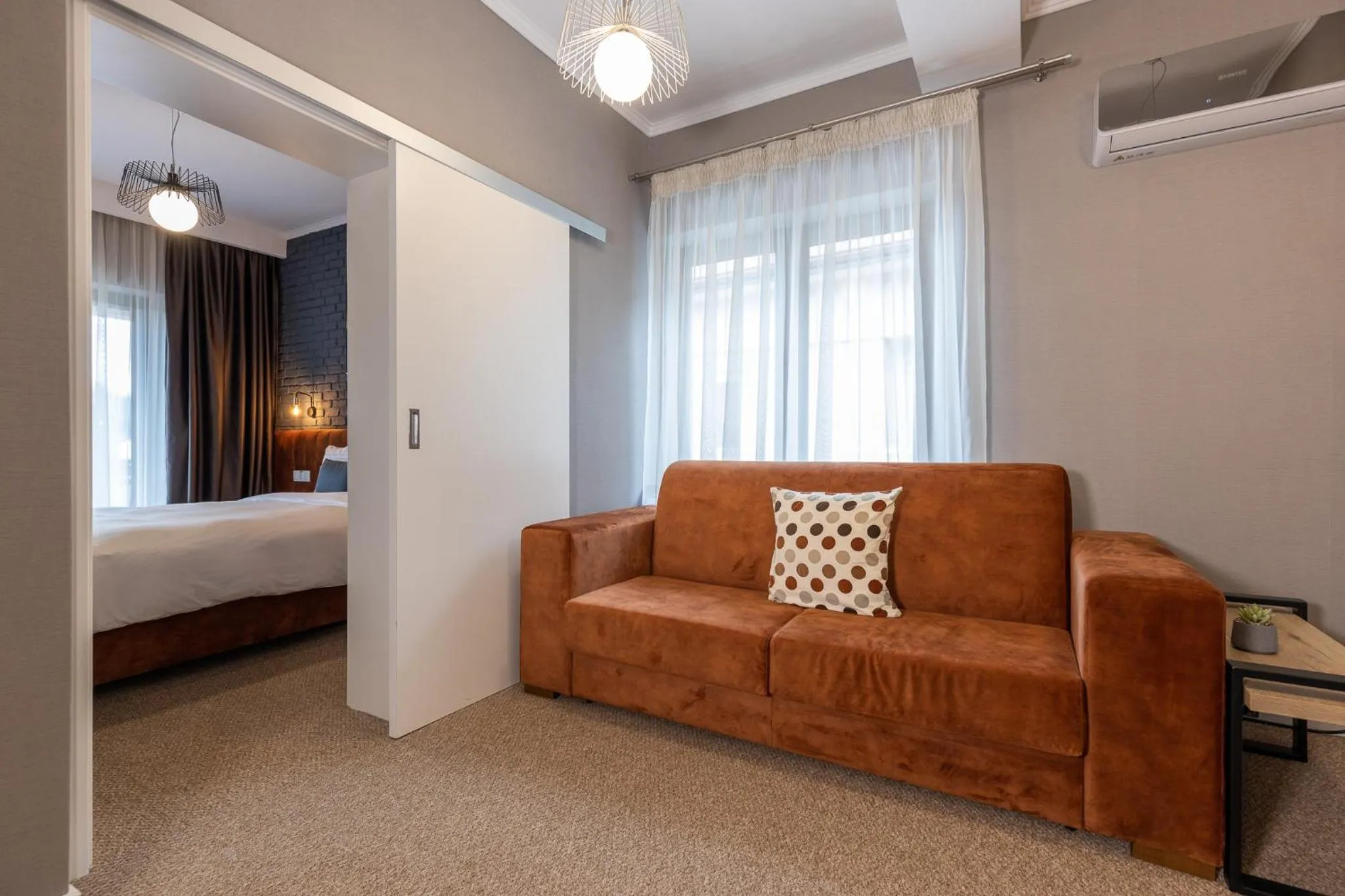 Living room, Bed in UpperHouse Suites & More