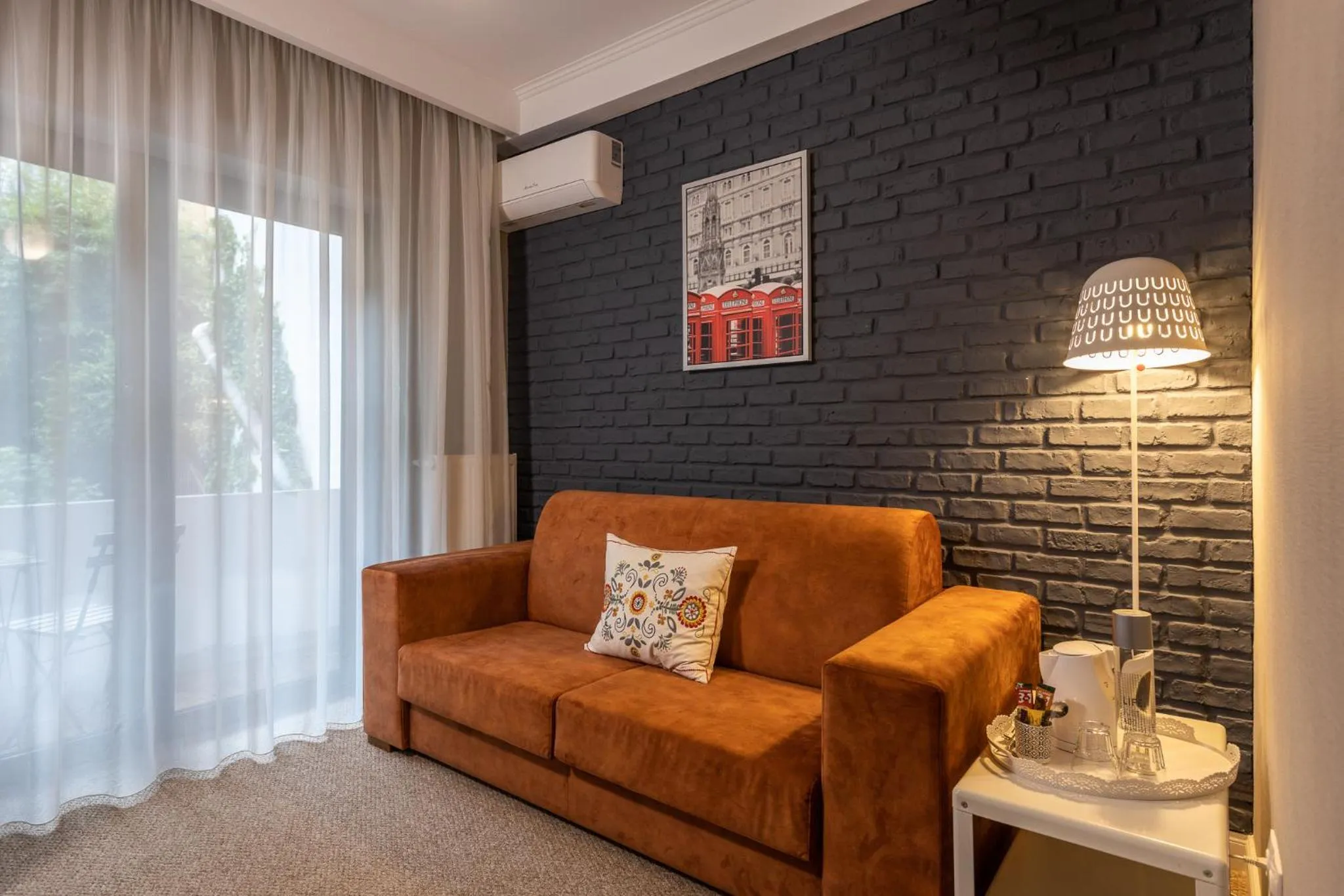 Living room in UpperHouse Suites & More