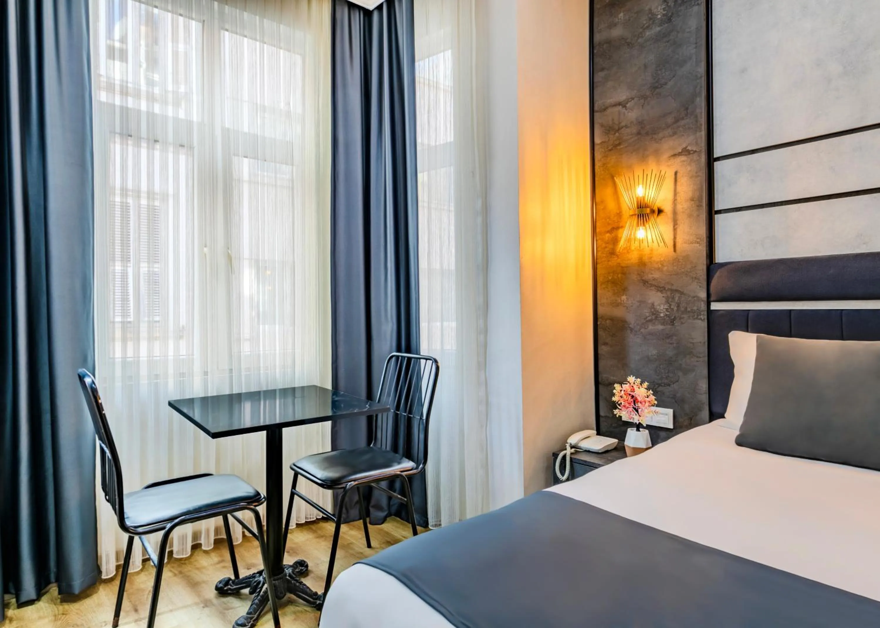 Bed in La Pazza Suites