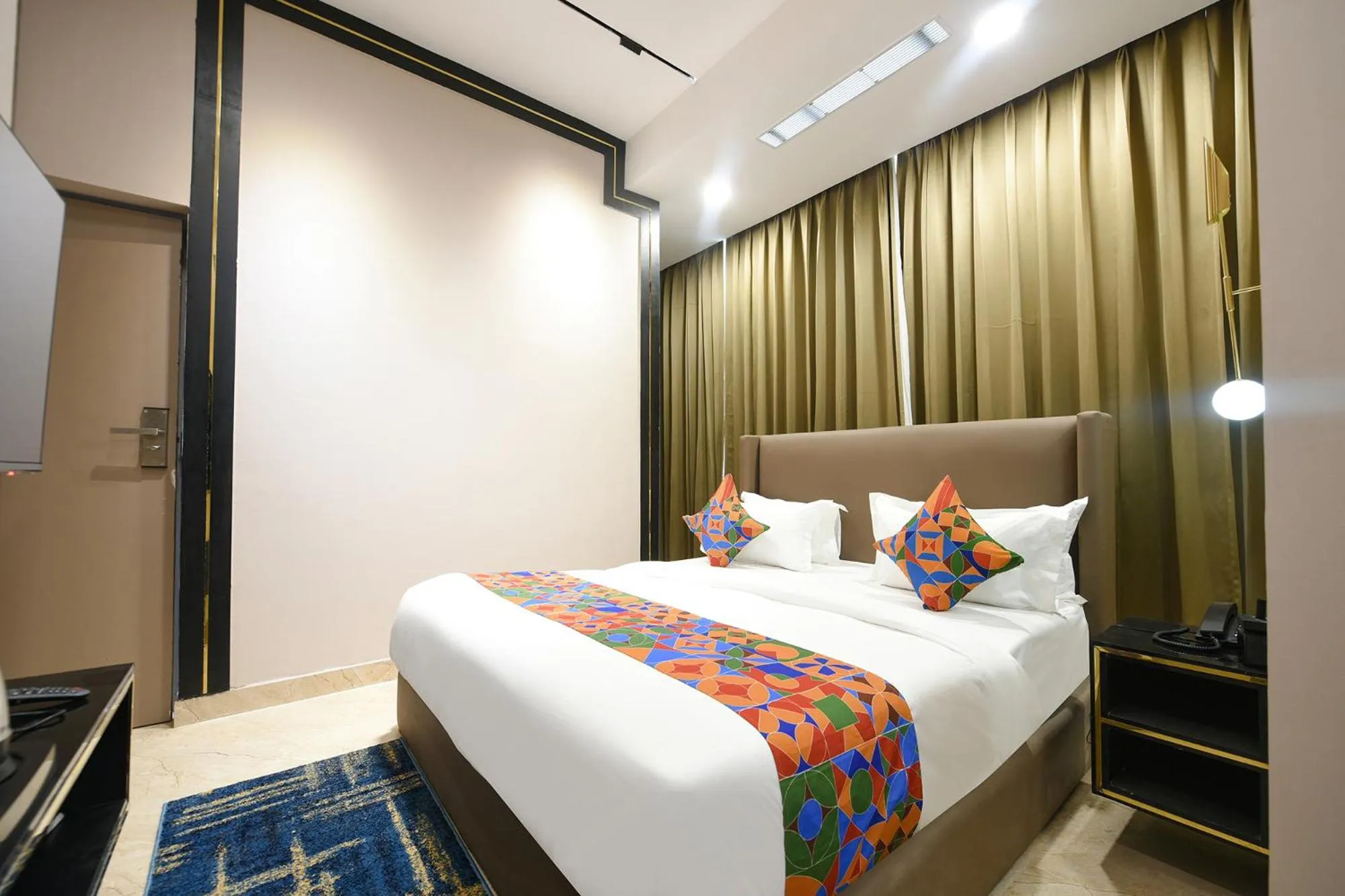 Bed in FabHotel Prime Elegance Suites