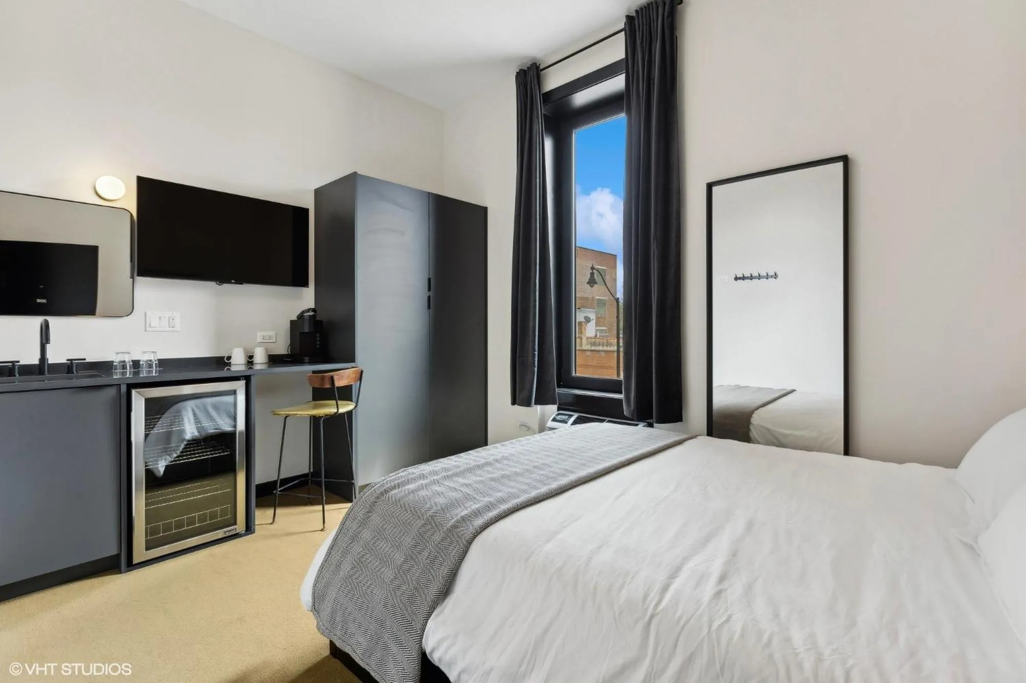 Bed in Logan Square SRO Hotel