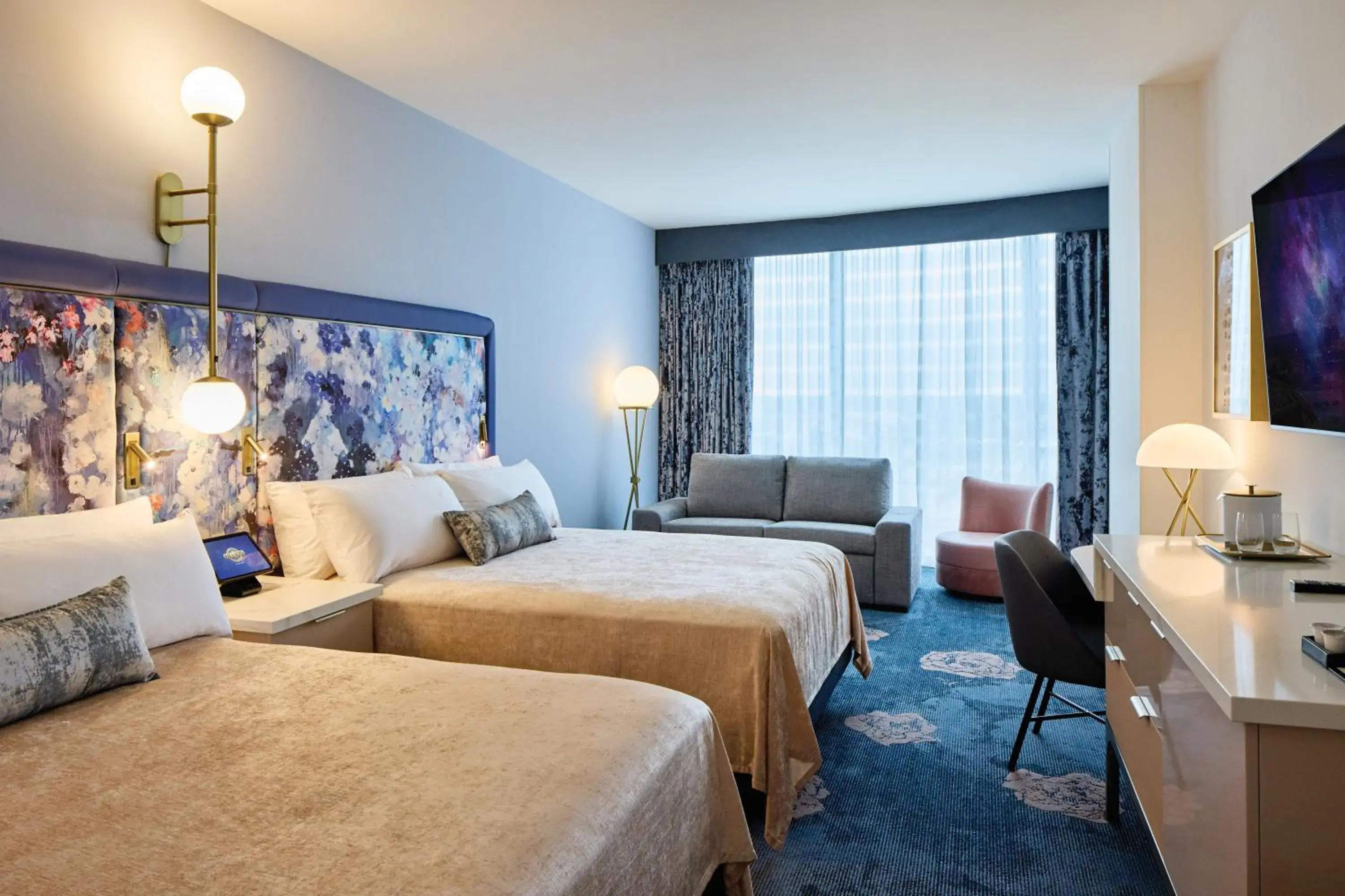 Deluxe 2 Queen Beds (Dedicated Entrance to Epic Universe**) in Universal's Helios Grand Hotel, a Loews Hotel Deluxe 2 Queen Beds (Dedicated Entrance to Epic Universe**) in Universal's Helios Grand Hotel, a Loews Hotel