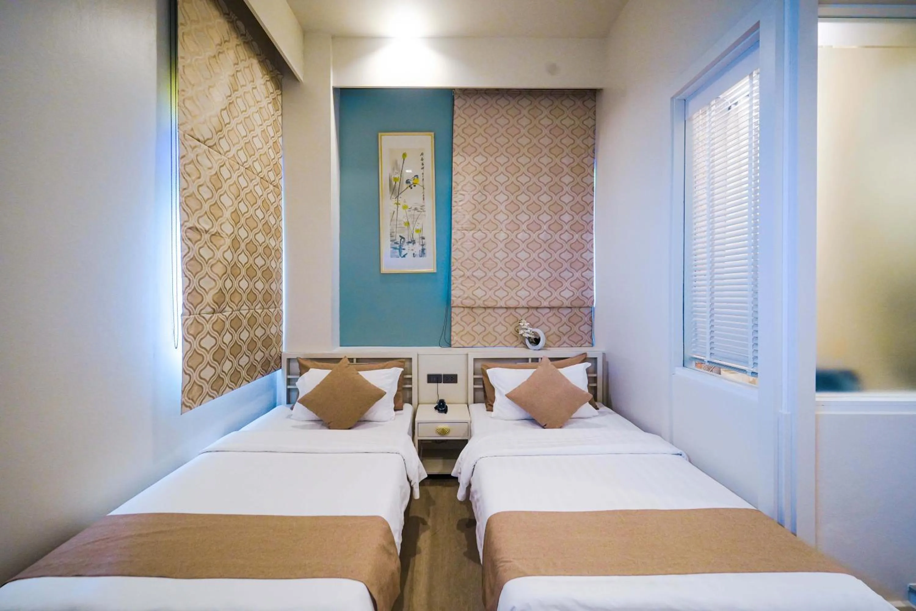 Bed in O'nya Phuket Hotel