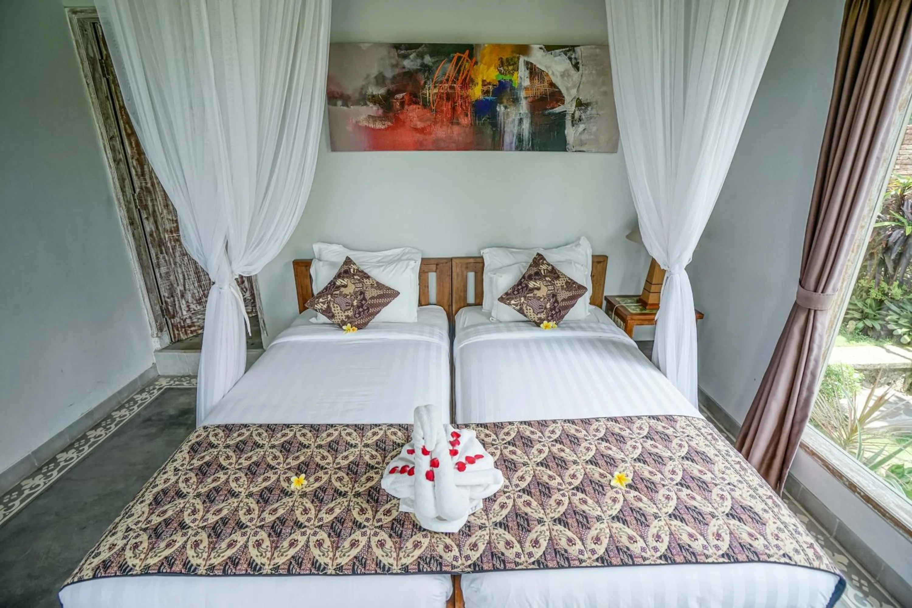 Bed in KTS Balinese Villas