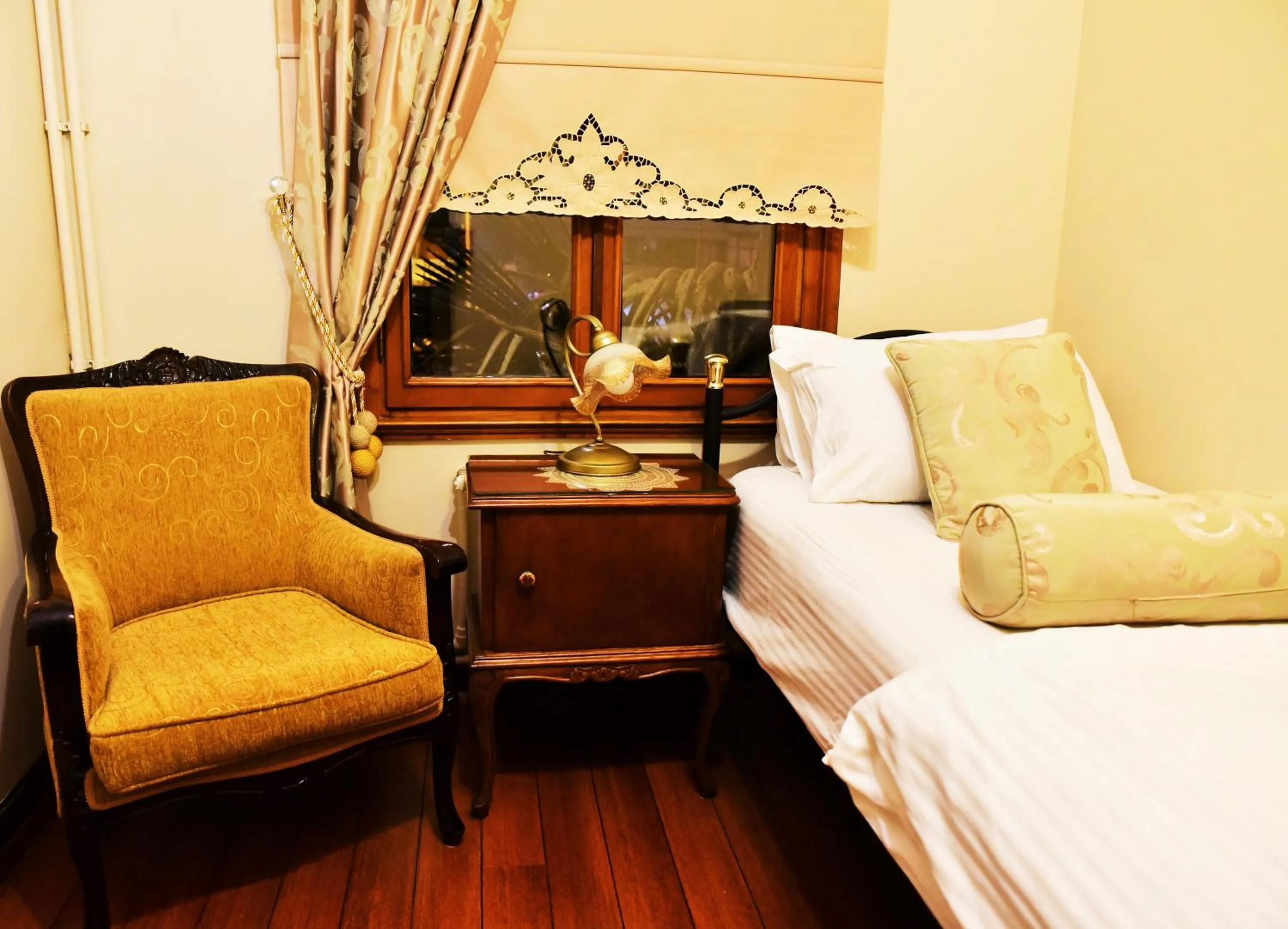 Seating area, Bed in Ottoman Suites by Sera House