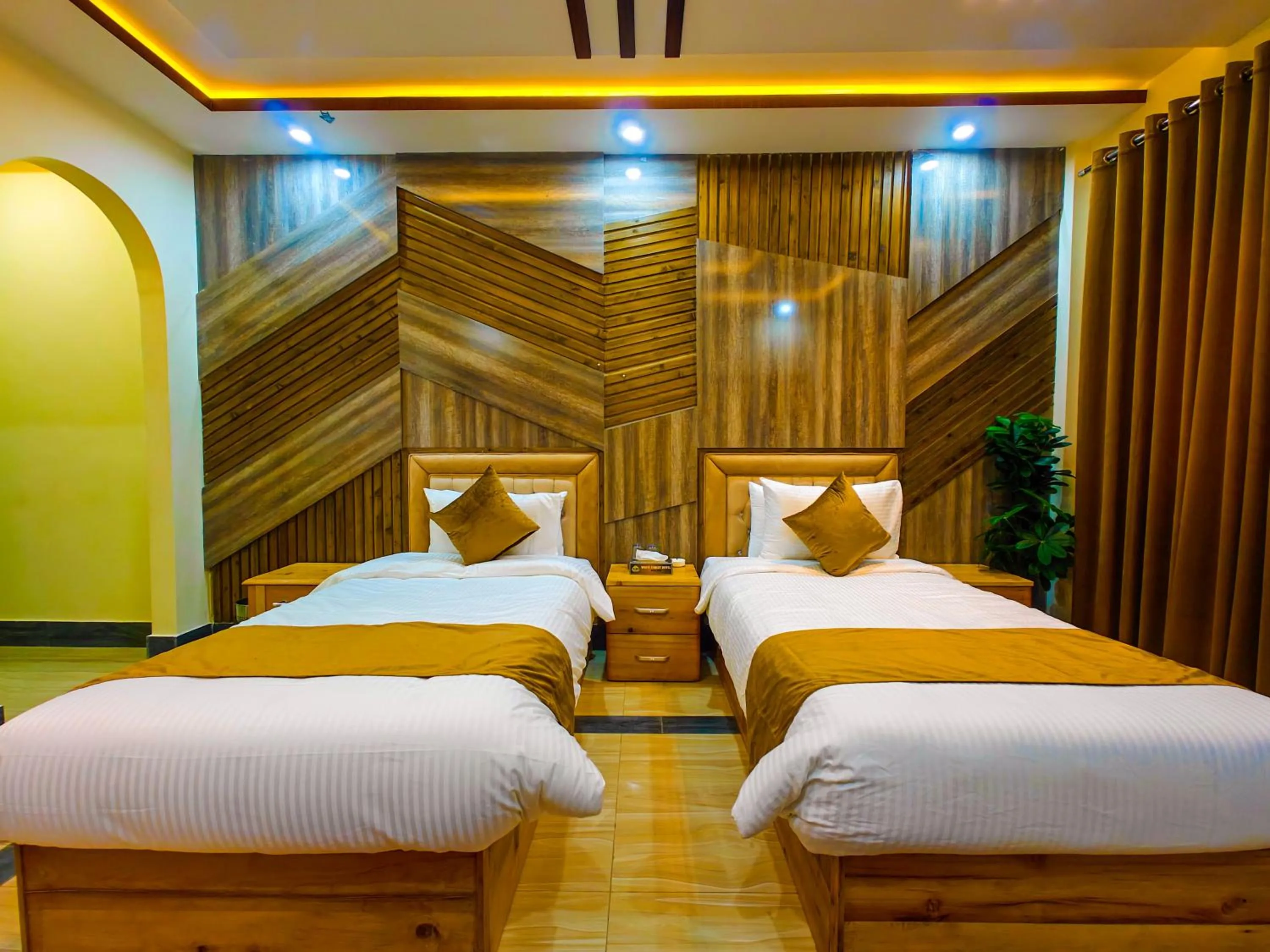 Bed in Kabirs Hotel Kalam
