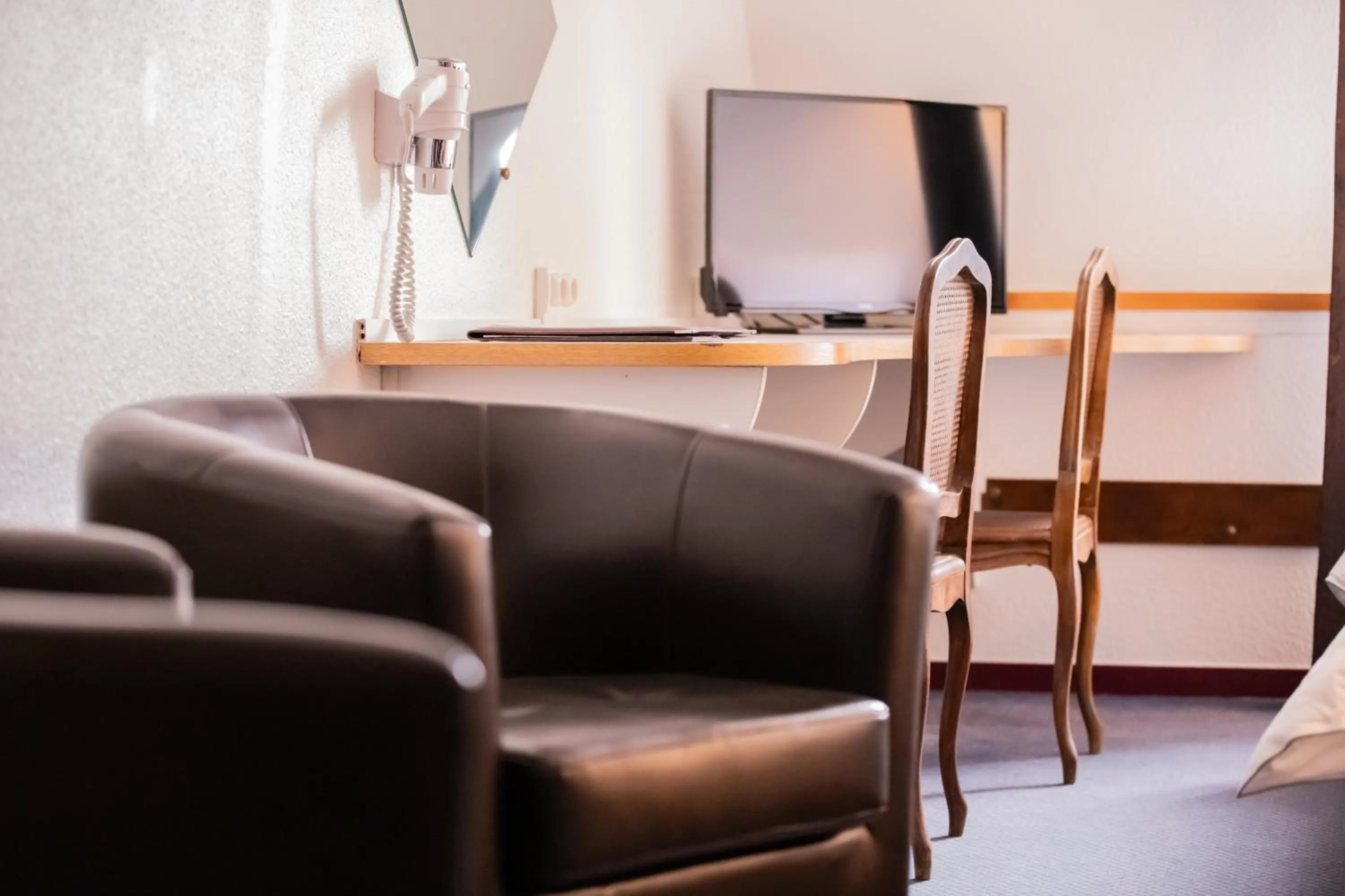 Seating area in Hôtel Les Trois Luppars