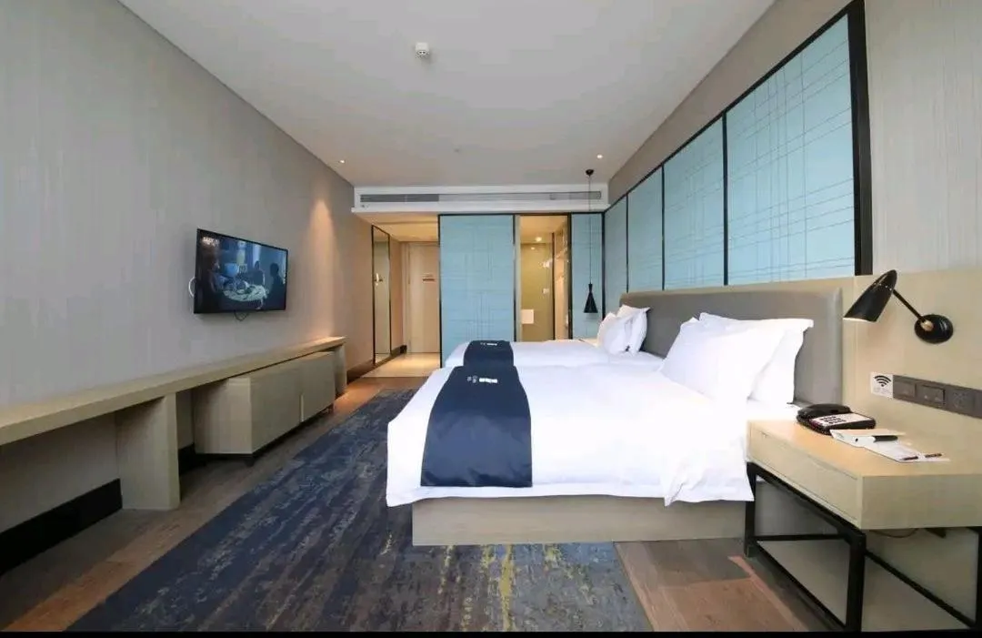 Bed in Echarm Hotel Fengcheng Fengshui Lake