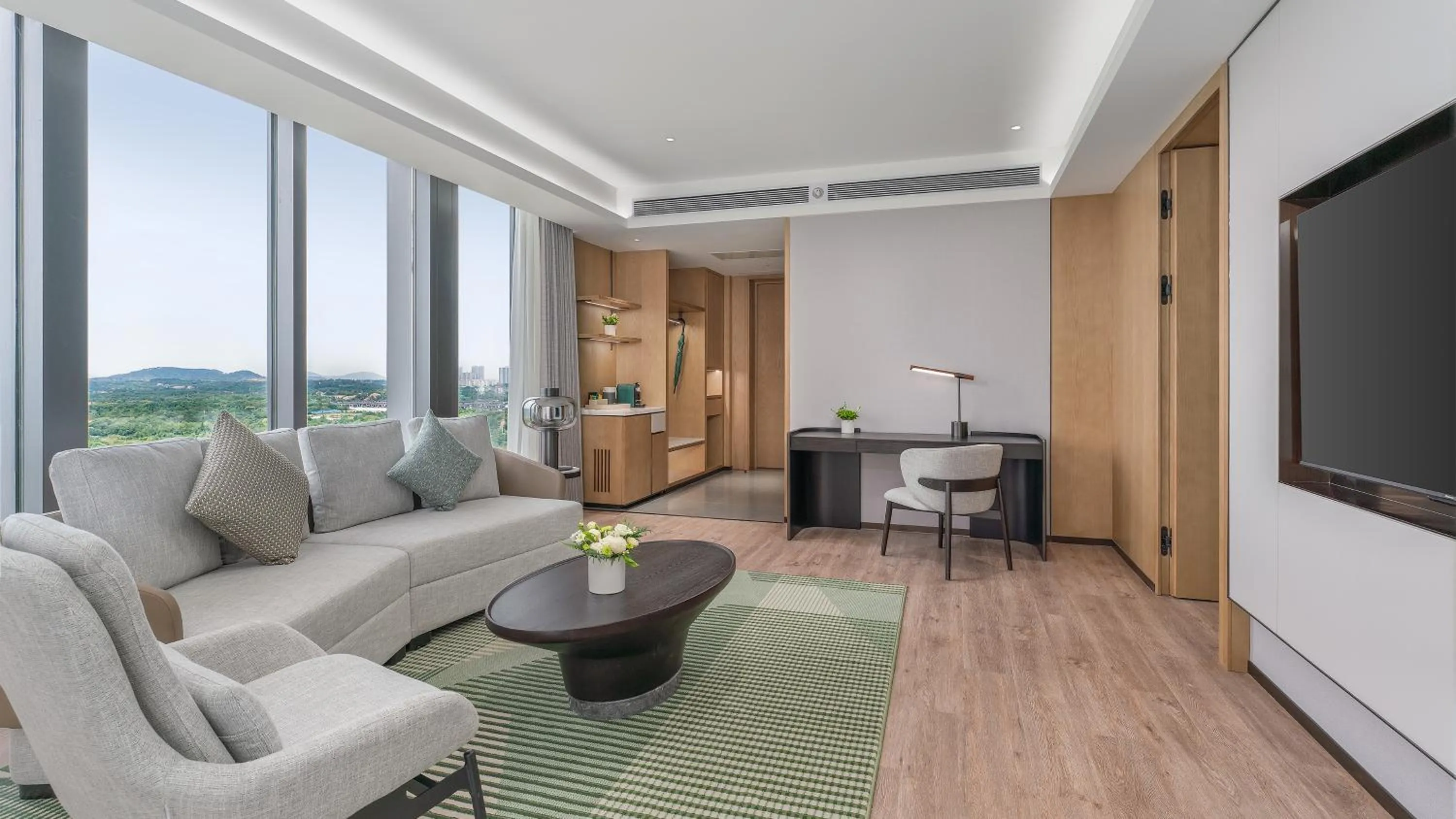 Living room in Holiday Inn Wuhan Houguan Lake by IHG