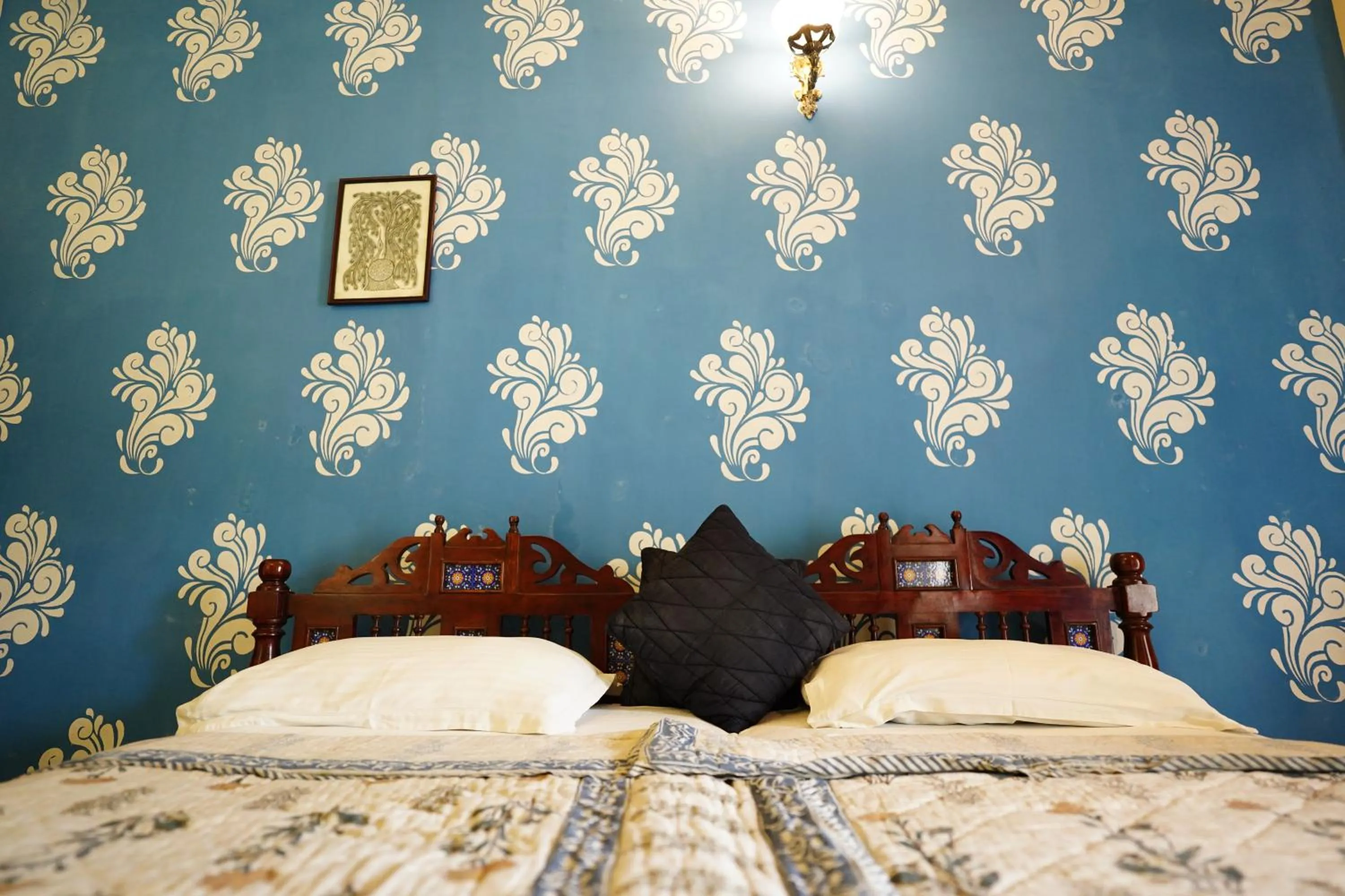 Bed in Haveli Kalwara - A Heritage Hotel