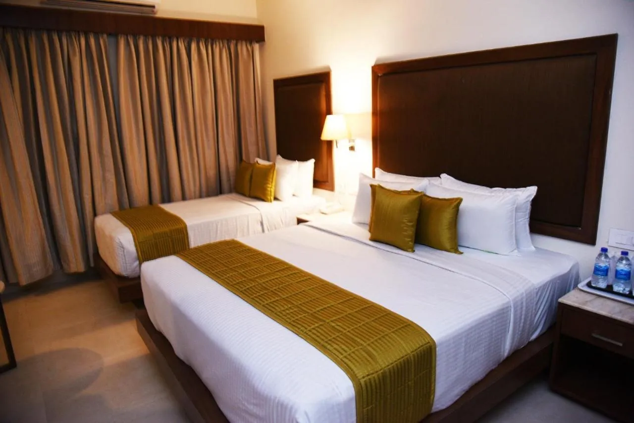 Bed in Hotel Rameswaram Grand