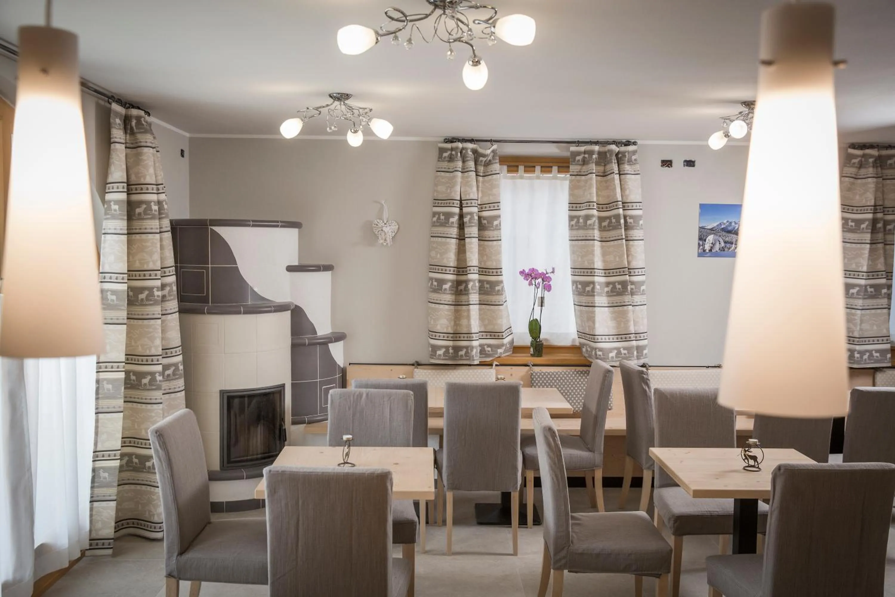 Communal lounge/ TV room in Aparthotel Dolomites Living&Relax