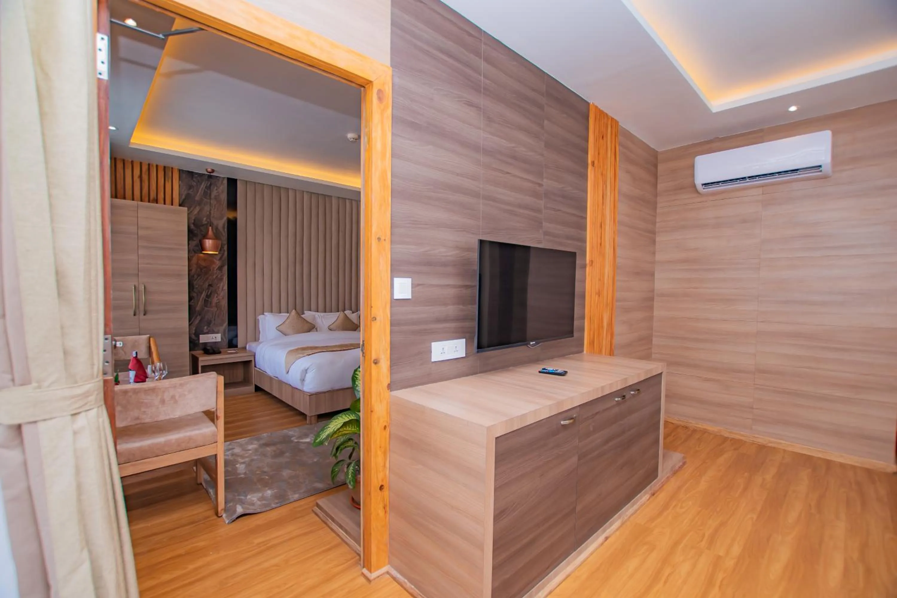 Communal lounge/ TV room, Bed in Temple Himalaya Hotel & Spa